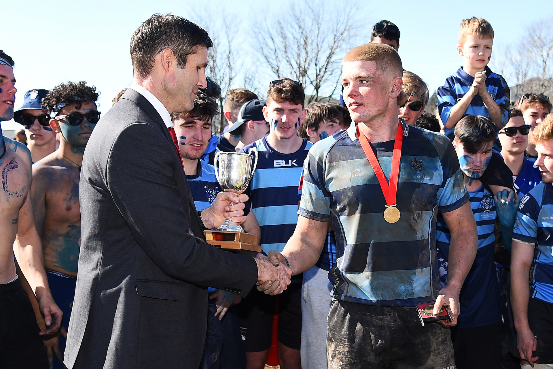 Anton Segner receiving the UC Championship trophy on behalf of Nelson College. Photo / Photosport