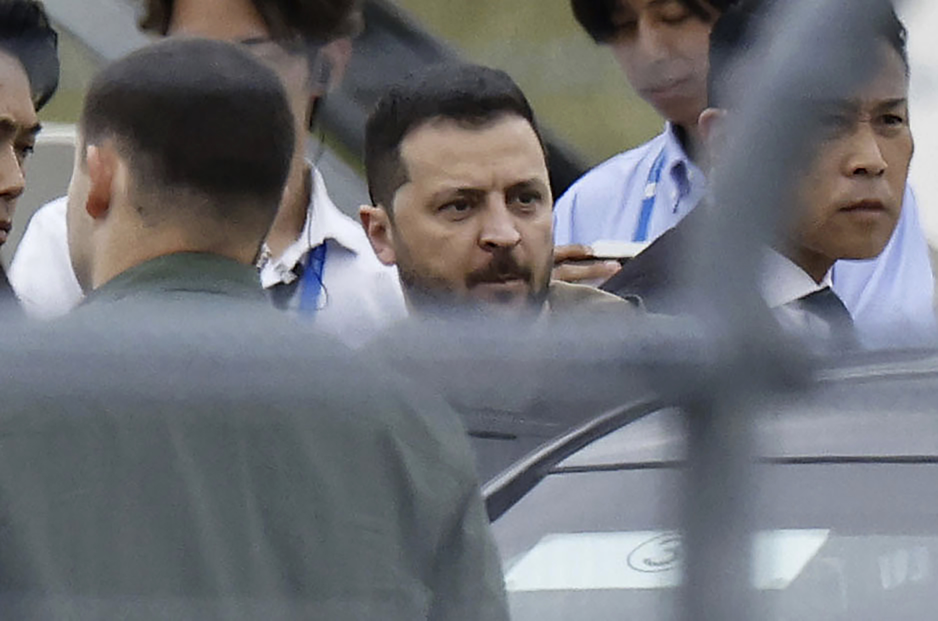 Ukrainian President Volodymyr Zelenskyy walks to a car upon his arrival at Hiroshima Airport today. Photo / AP