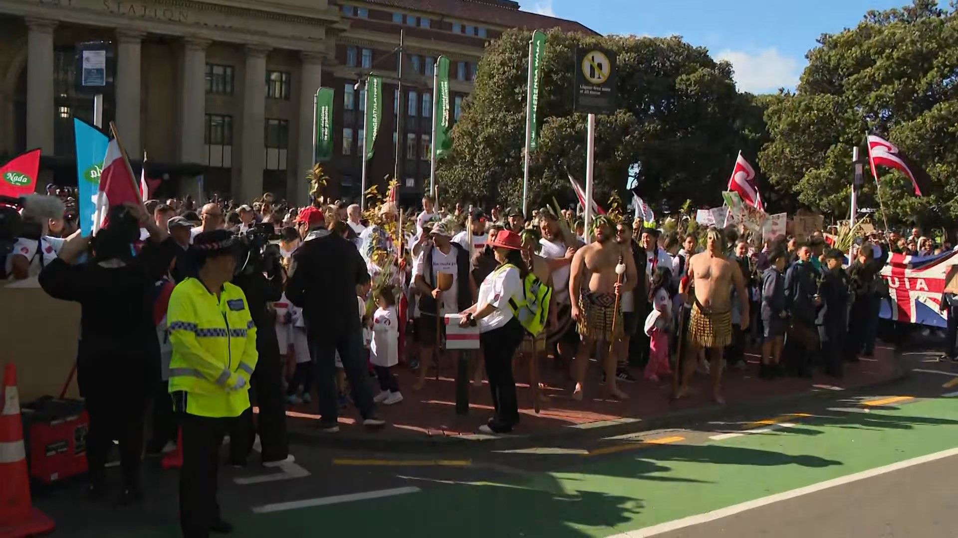 The peaceful hīkoi gathers outside Wellington Railway Station.
