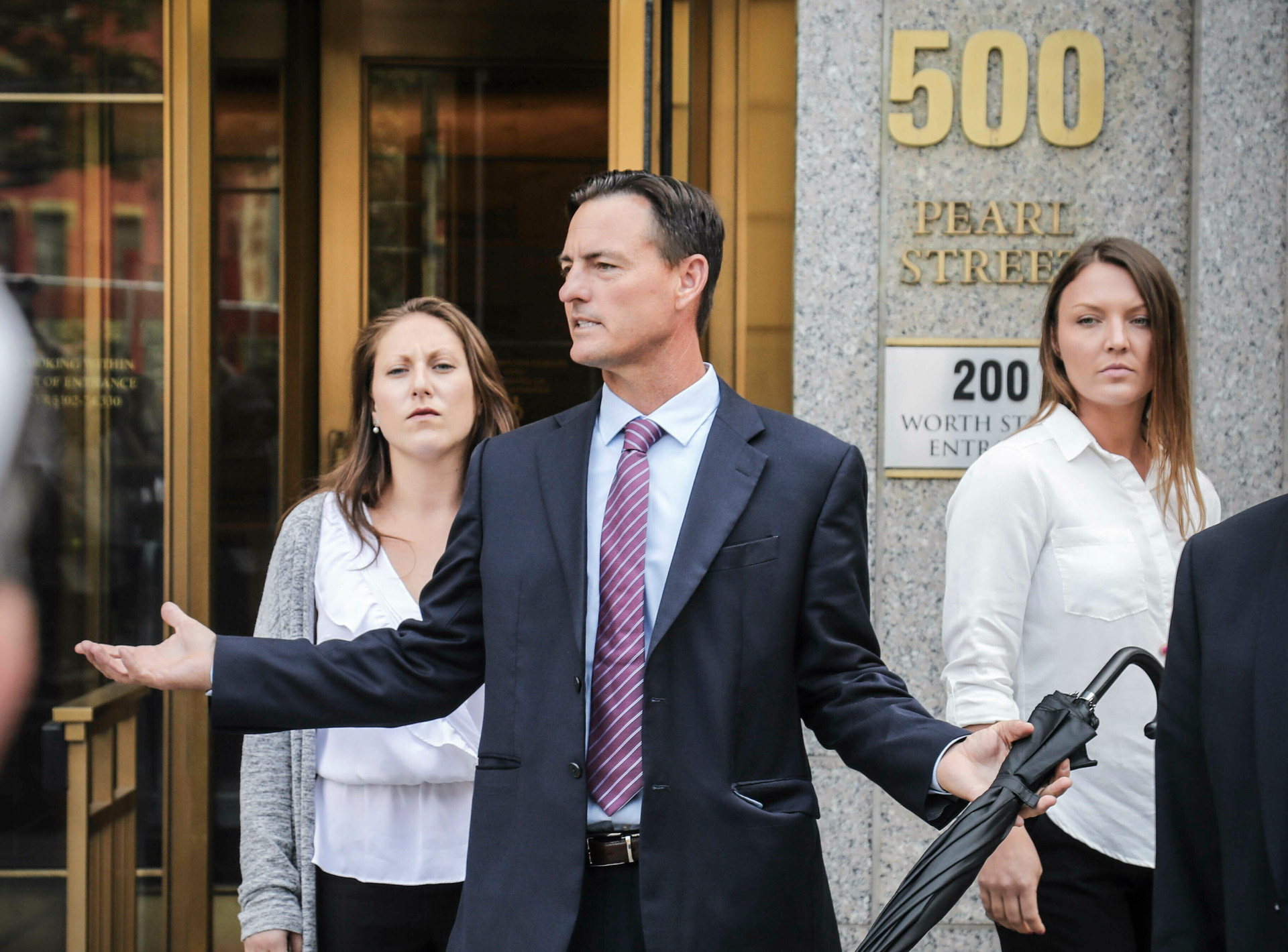 Victim lawyer Brad Edwards leaves with his clients Michelle Licata, left, and Courtney Wild, right, after a hearing at Manhattan Federal Court for wealthy financier Jeffrey Epstein. Photo / AP