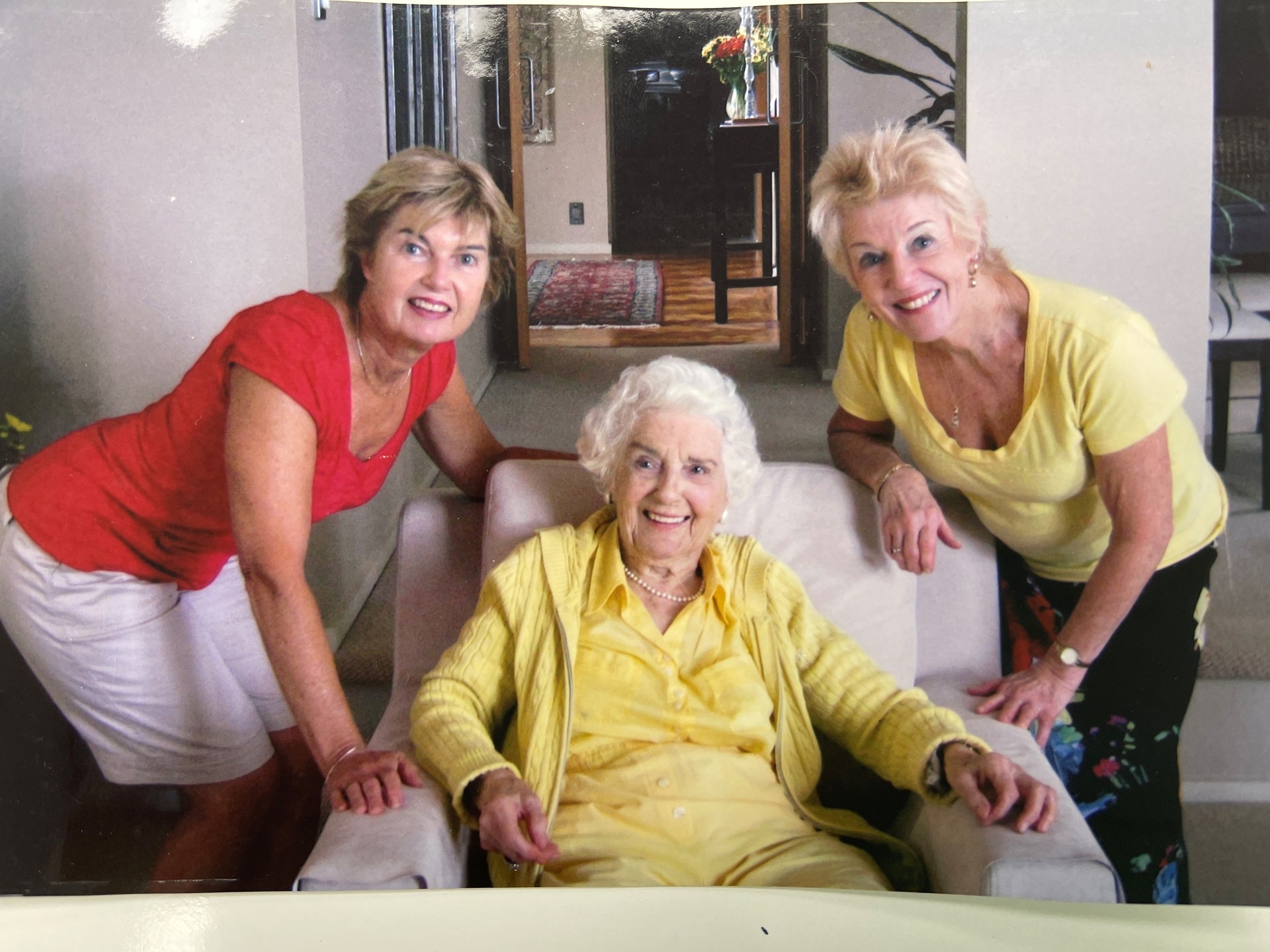 Sisters Linda Brown (left) and Andrea Dorn (right) stand beside their since passed mother Audrey Hicks, who was diagnosed with breast cancer in her 70s. Photo / Supplied
