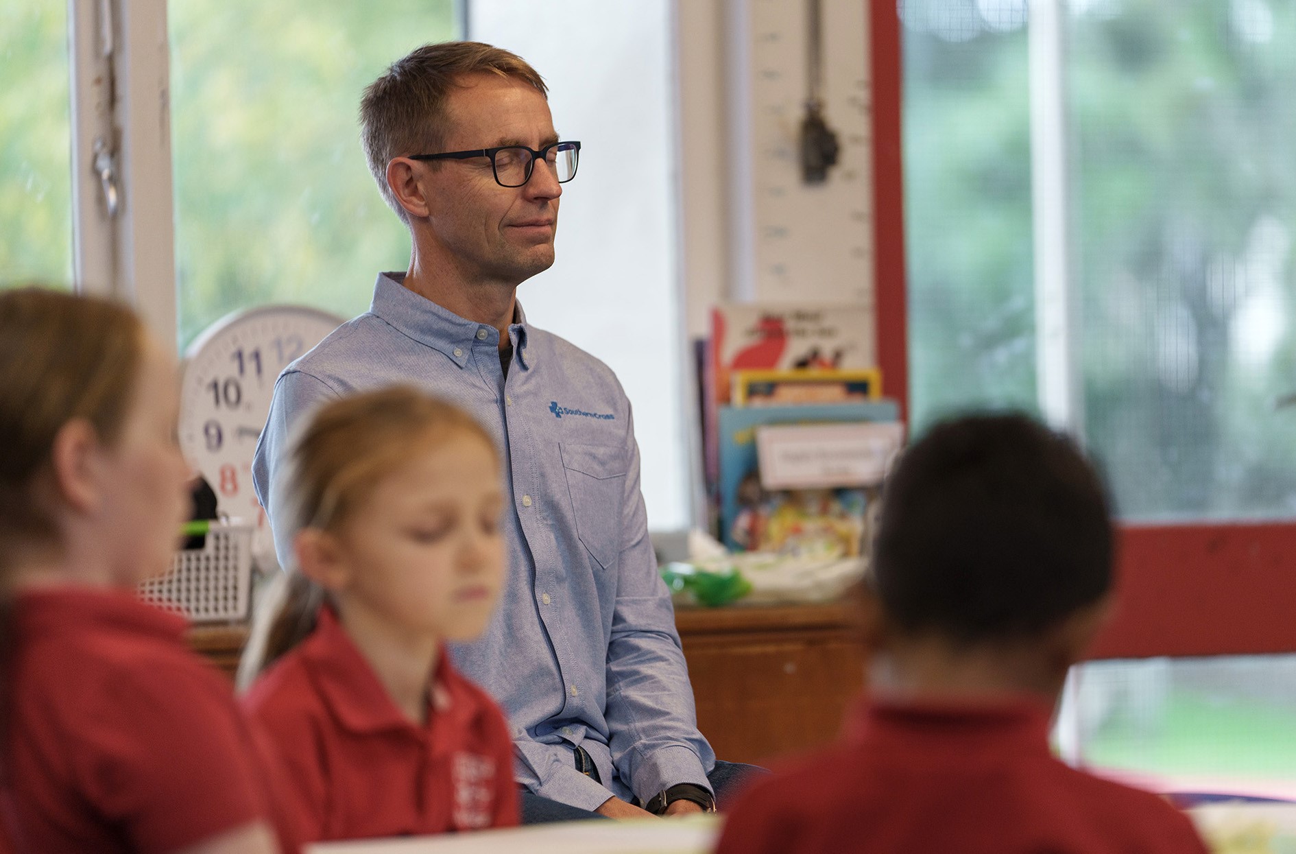 Sir Ashley Bloomfield takes part in a Pause Breathe Smile session at an Auckland school. 