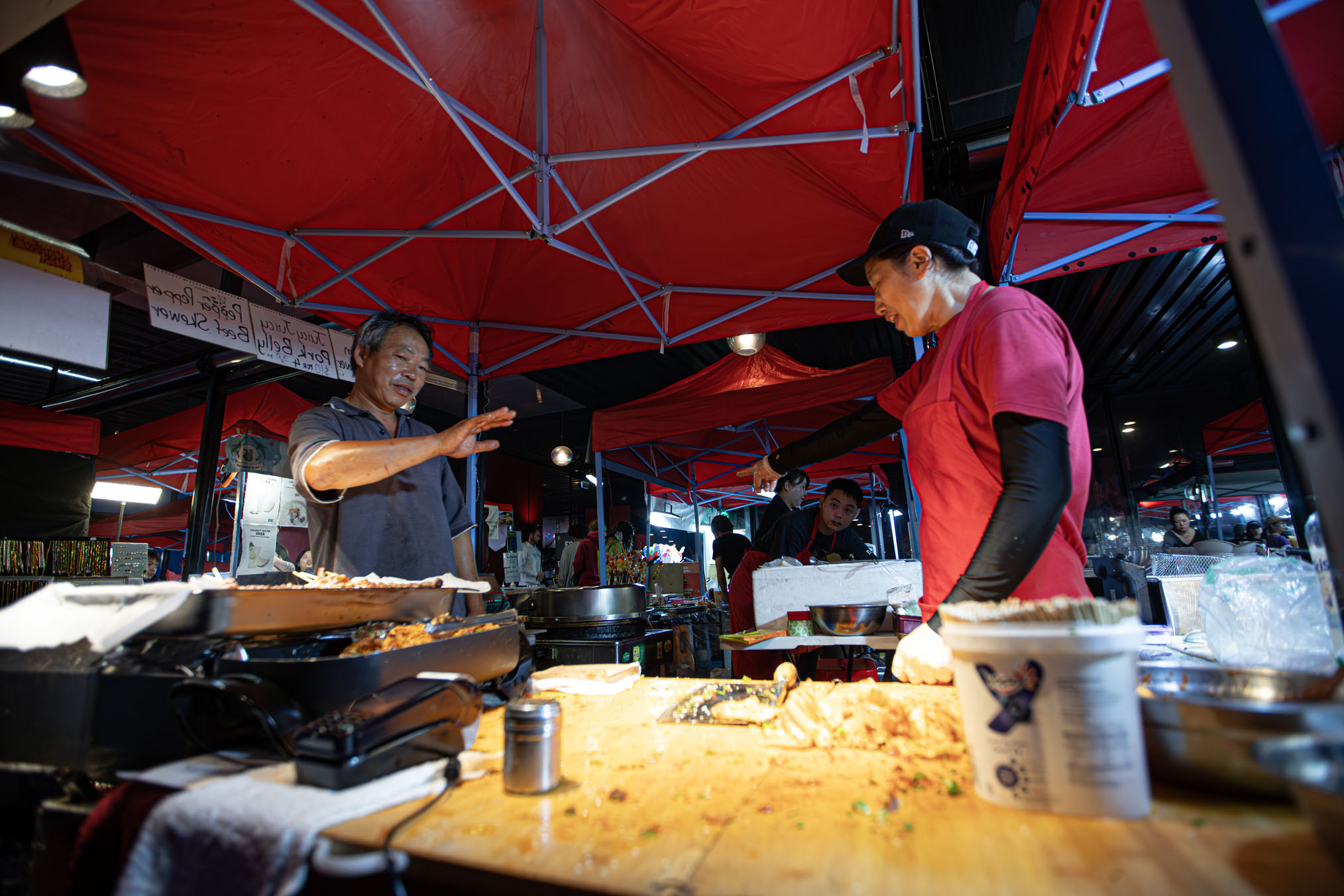 A live DJ, food trucks and roving performers braved the rain in Wynyard Quarter while partied at the many inner-city restaurants and bars offering cocktails, bubbles and lavish food. Photo / Hayden Woodward
