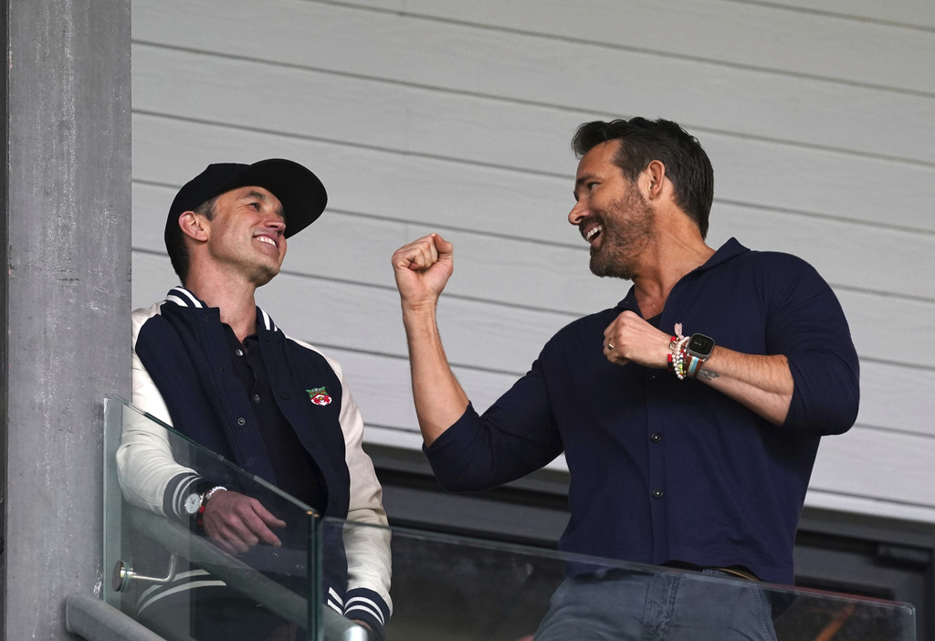 Wrexham co-owners Rob McElhenney, left, and Ryan Reynolds in the stands during the National League football match between Wrexham and Boreham Wood. Photo / AP