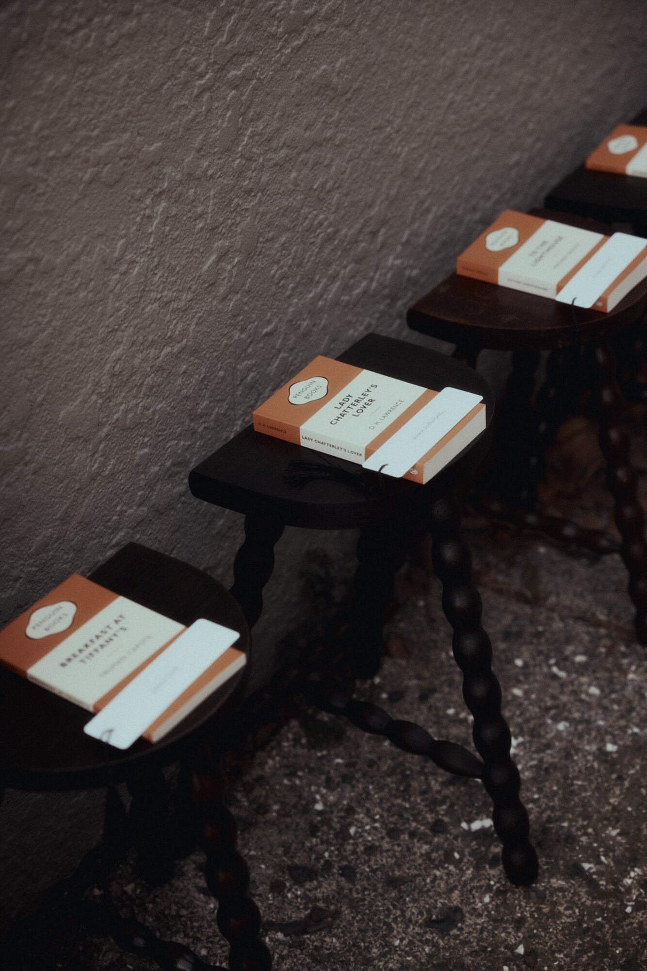 Books on the chairs of attendees at Harris Tapper.