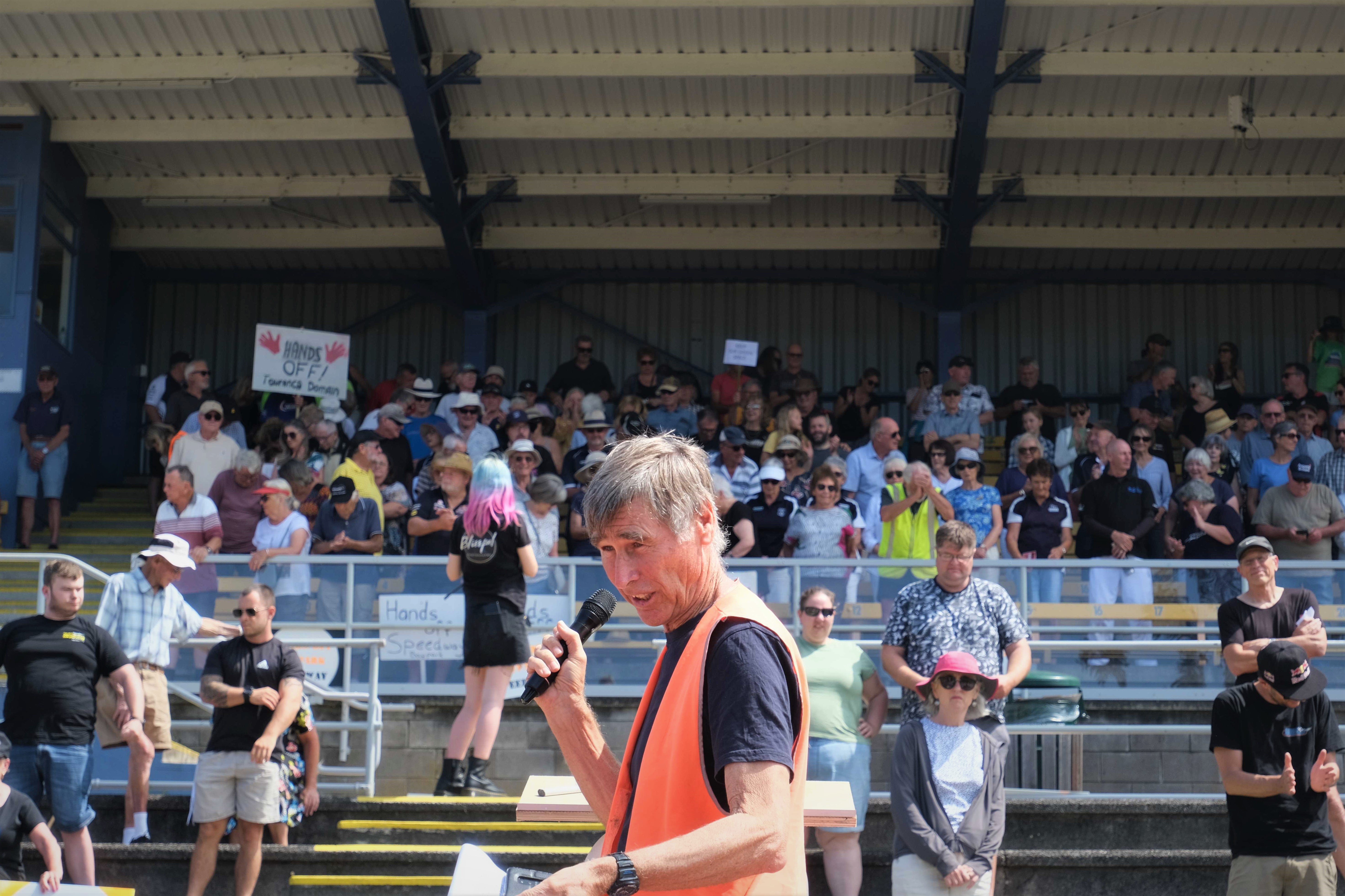 Tauranga Lawn Tennis Club president Philip Brown (centre) at the Tauranga Domain protest on Sunday. Photo / Maryana Garcia
