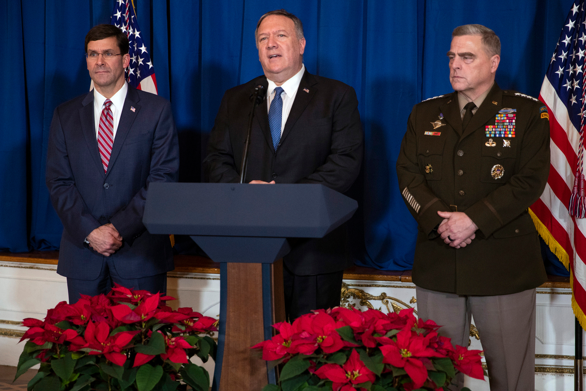 Secretary of Defense Mark Esper, left, and Chairman of the Joint Chiefs of Staff Gen. Mark Milley, right, listen as Secretary of State Mike Pompeo delivers a statement on Iraq and Syria. Photo / AP