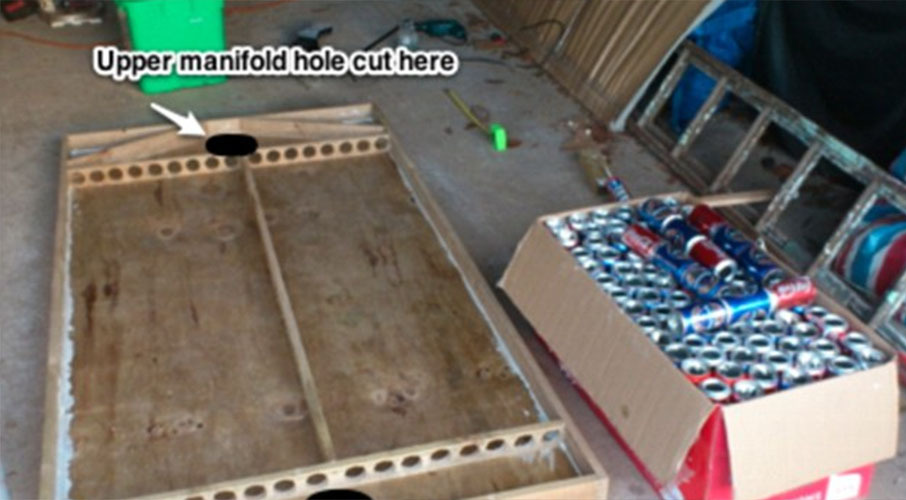 A clear polycarbonate side was fitted to the plywood frame allowing light to shine on the cans. Photo / Frugal Kiwi