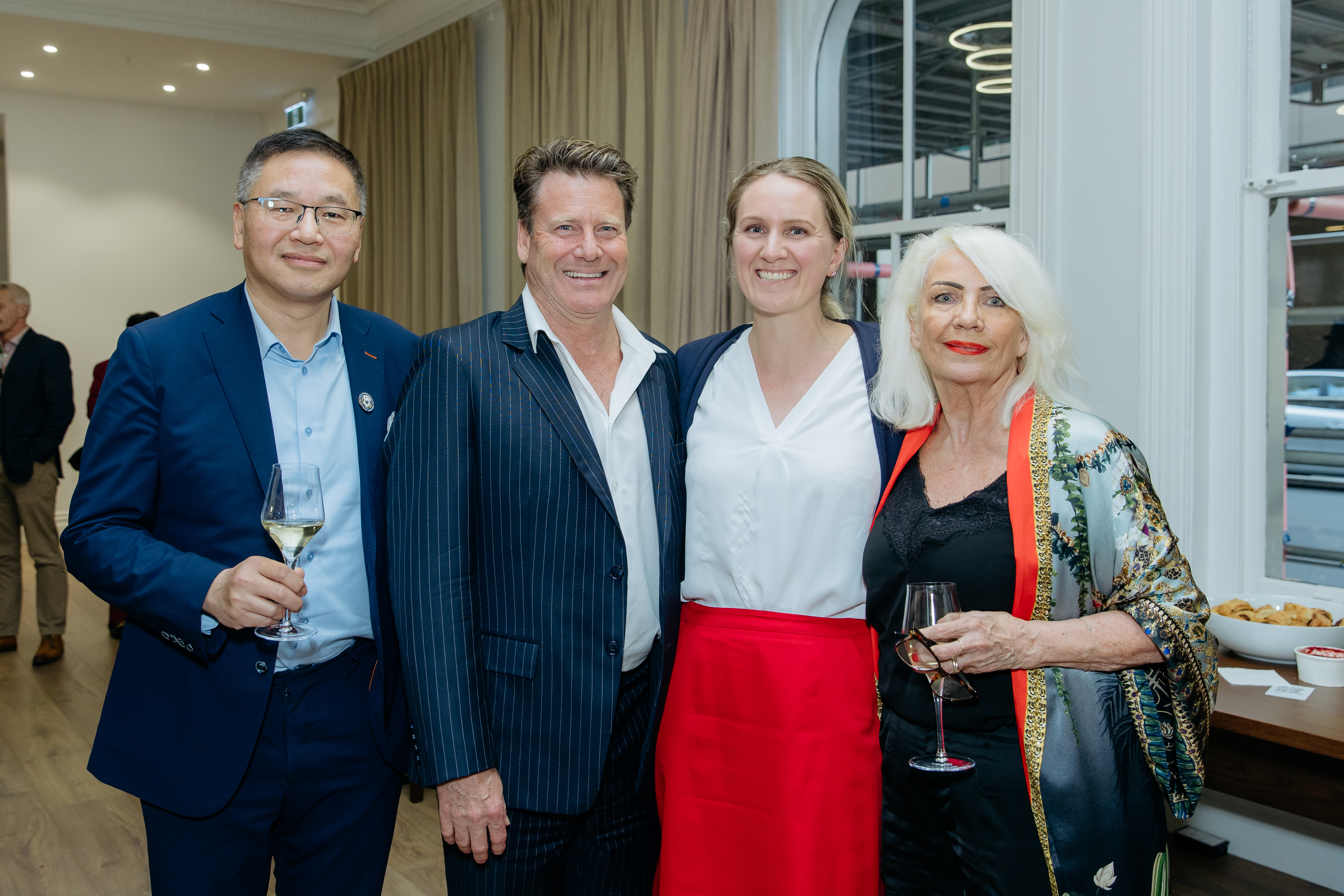 Frank Xu (Shundi), Gavin Lloyd (Bayleys), Tamba Carleton (CBRE) and Jillie Clarke (Shundi) on September 3 at an event to market Seascape apartments in Auckland. Photo / Mala Photography