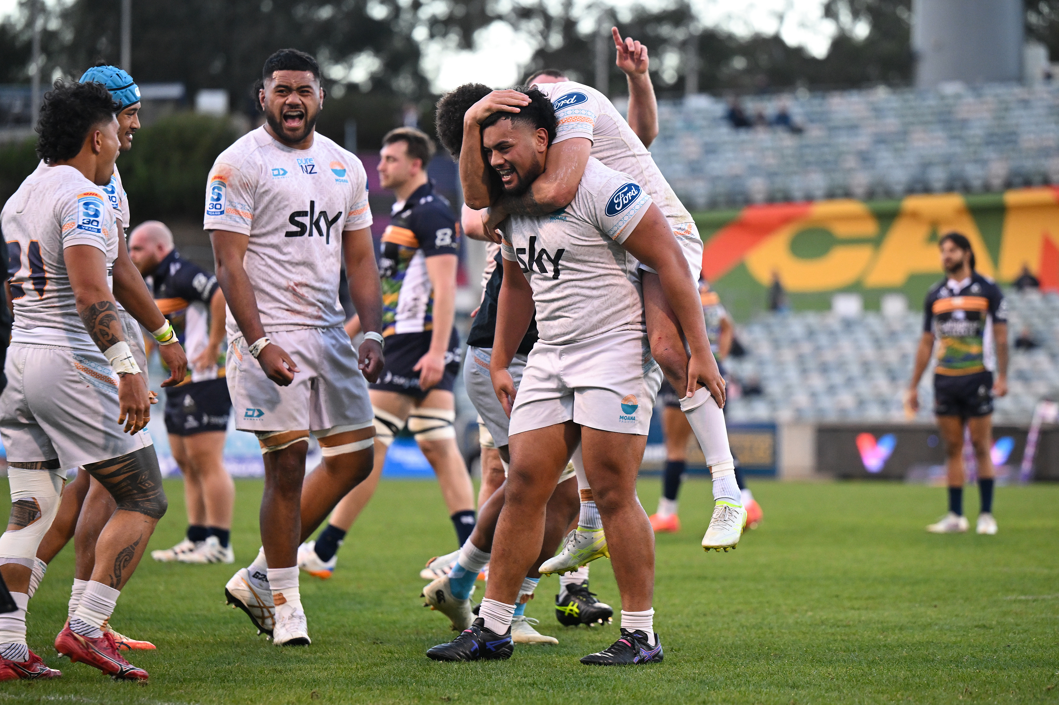 Moana Pasifika players celebrate after beating the Brumbies on the weekend. Photo / Photosport 