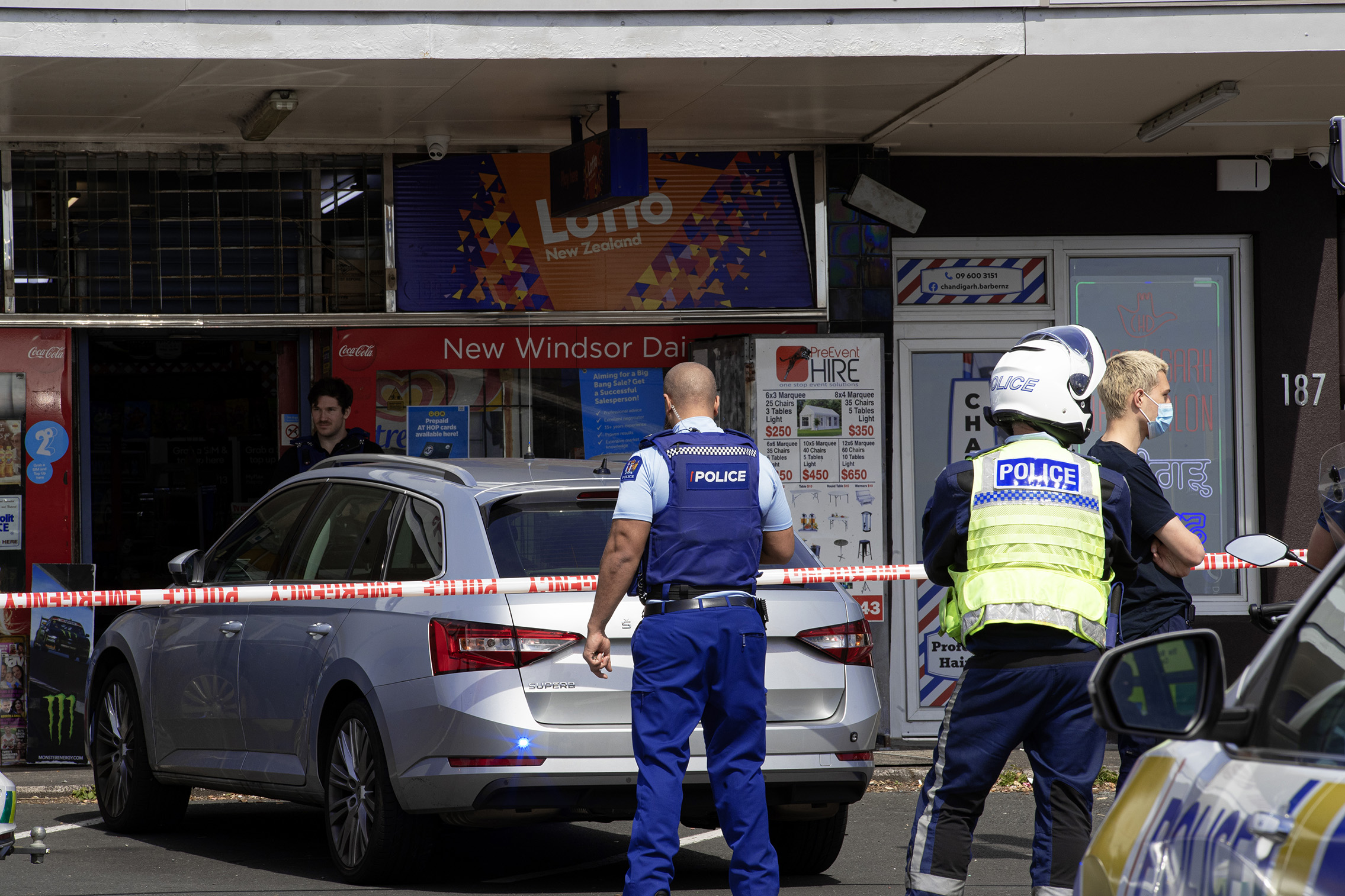Police arrested a 23-year-old man after a violent assault at an Auckland dairy this morning. Photo / Hayden Woodward 