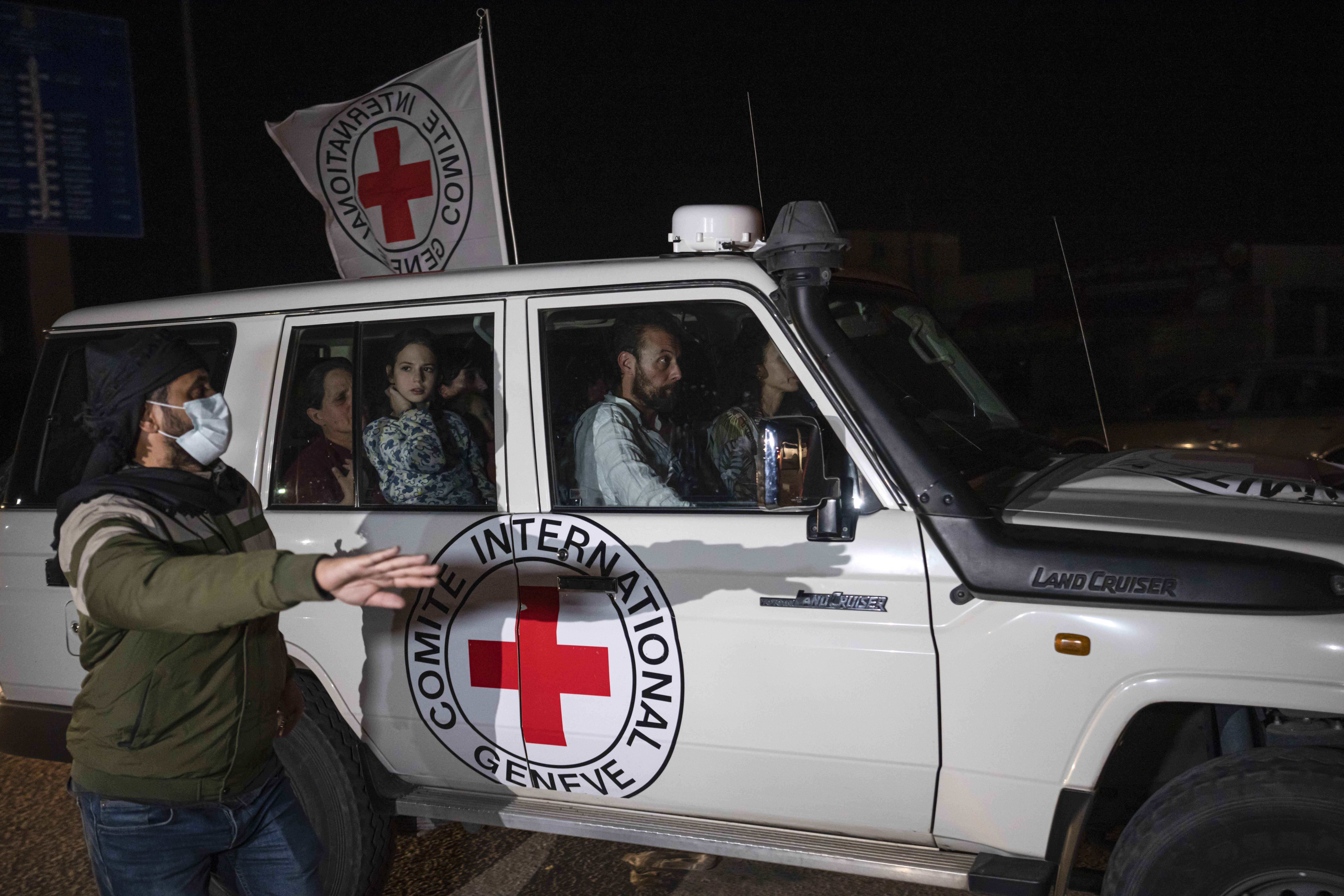 A Red Cross vehicle carrying Israeli hostages drives by at the Gaza Strip crossing into Egypt in Rafah on Saturday. Photo / AP