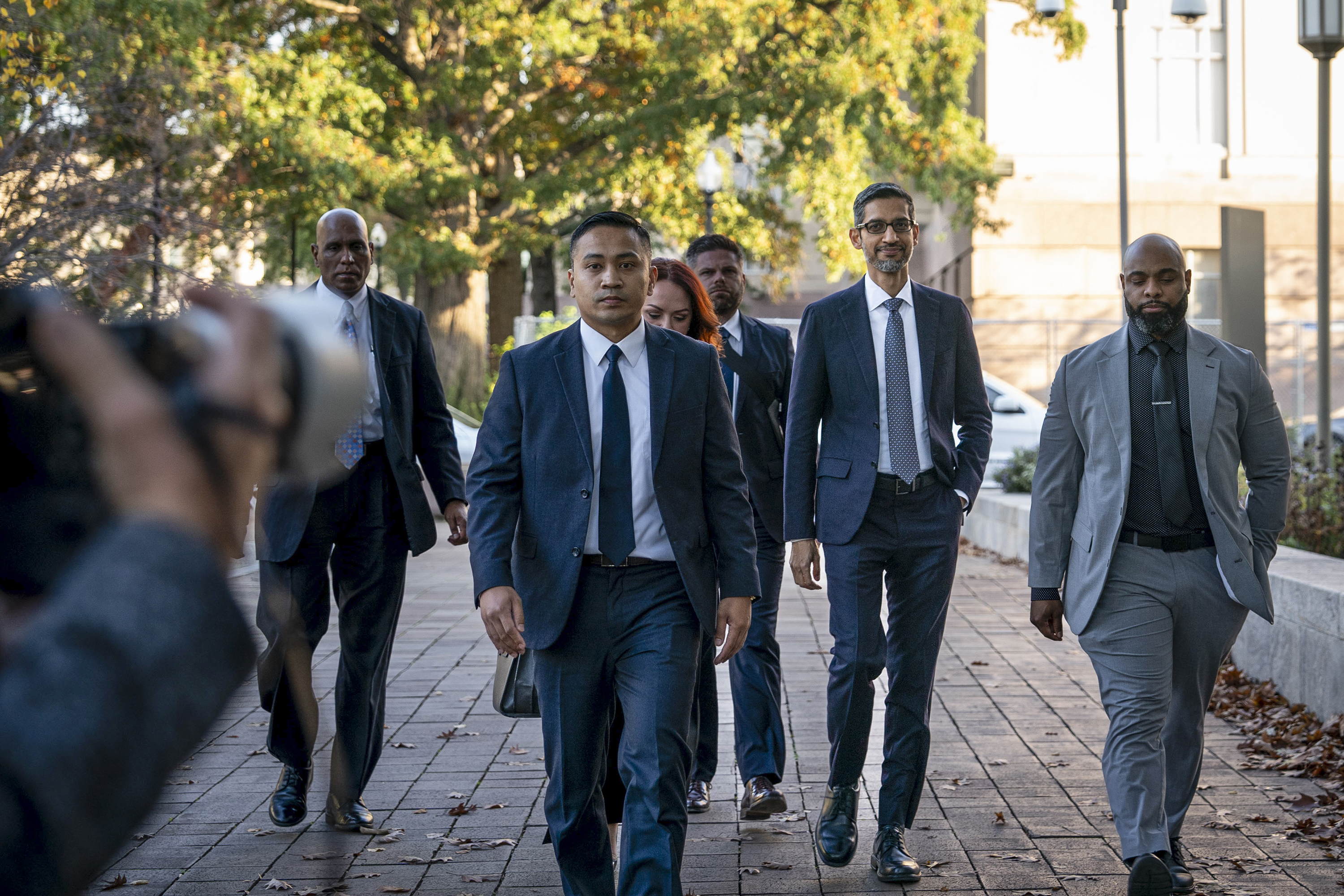 Sundar Pichai, Google's chief executive, second from right, arriving to testify at an antitrust case against Google in Washington DC last year. Photo / Haiyun Jiang, The New York Times
