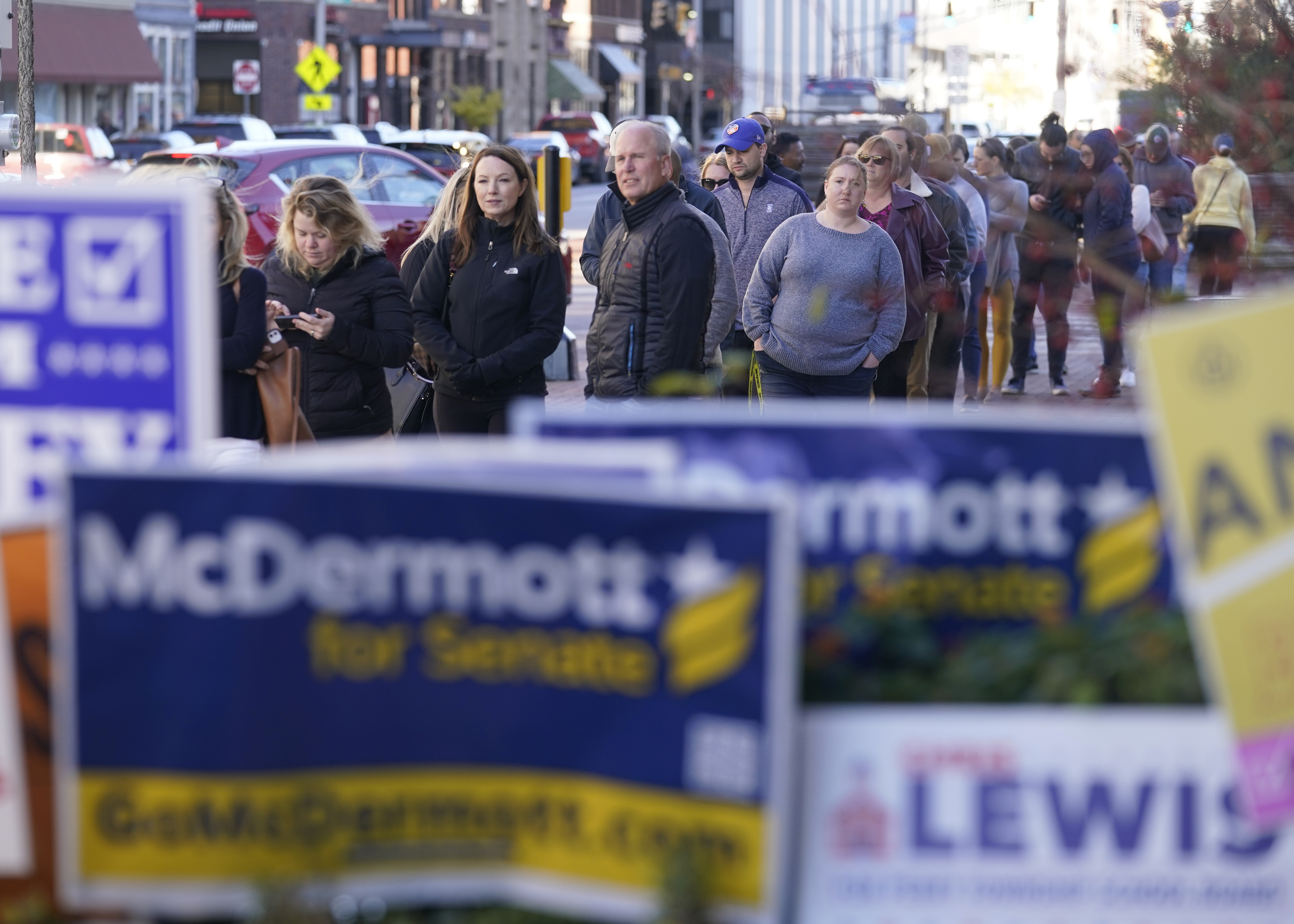 Voters stand in line waiting to cast their early ballots at the City-County Building in Indianapolis. Photo / AP