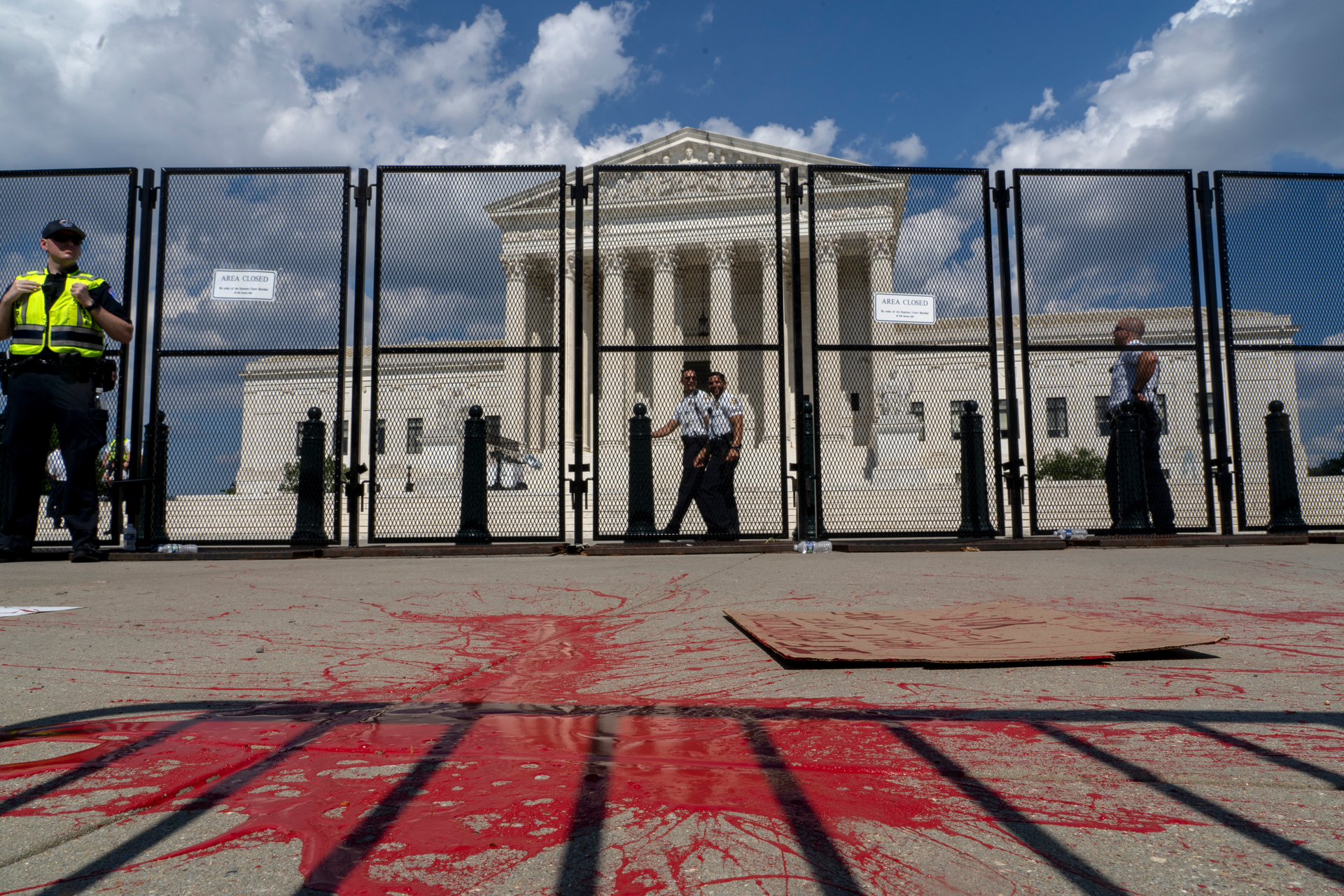 Red painting covers part of the sidewalk outside the Supreme Court as people protest about abortion in Washington on June 25. Photo / AP
