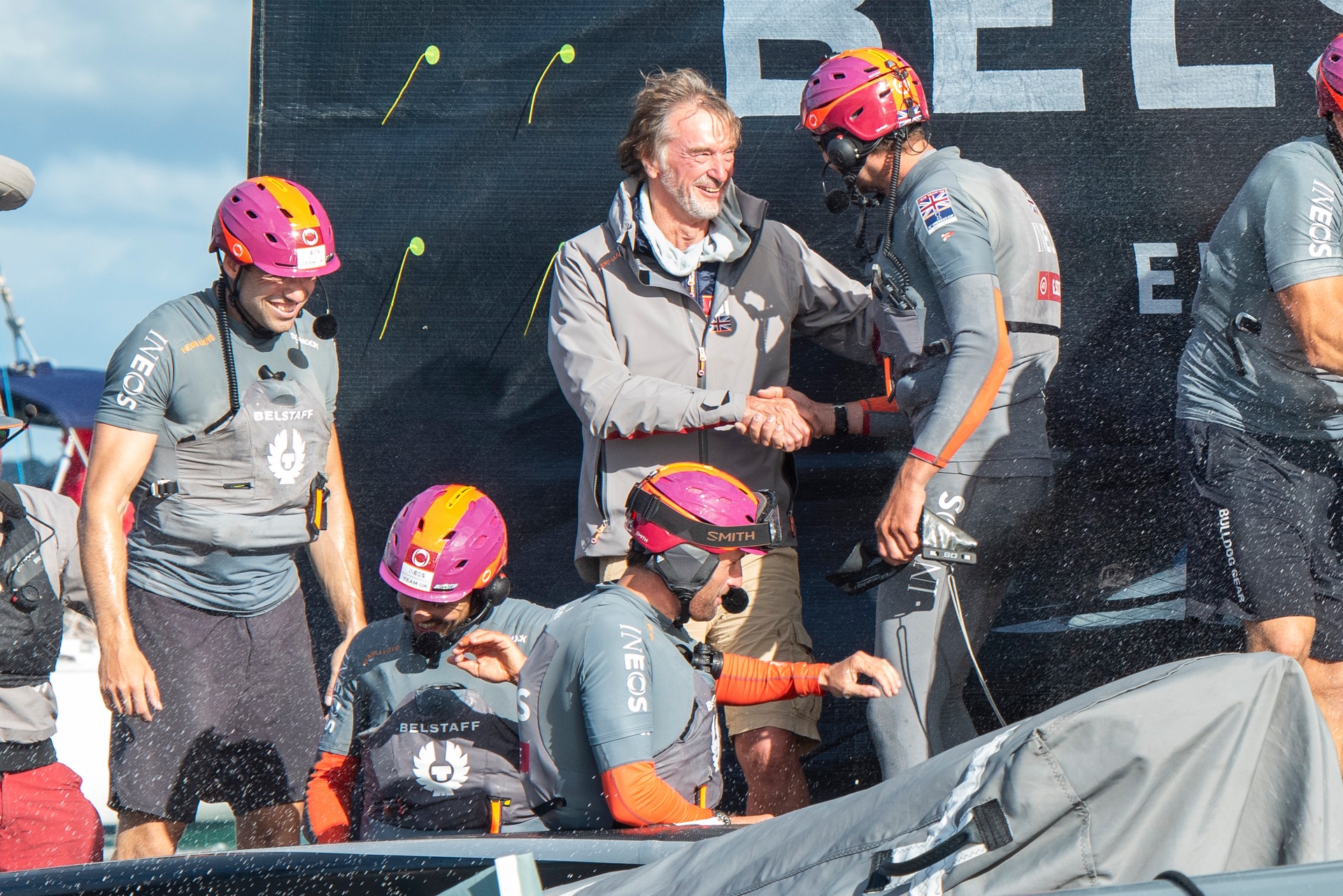 Sir Jim Ratcliffe shakes hands with Giles Scott during the Prada Cup round robin. Photo / Photosport
