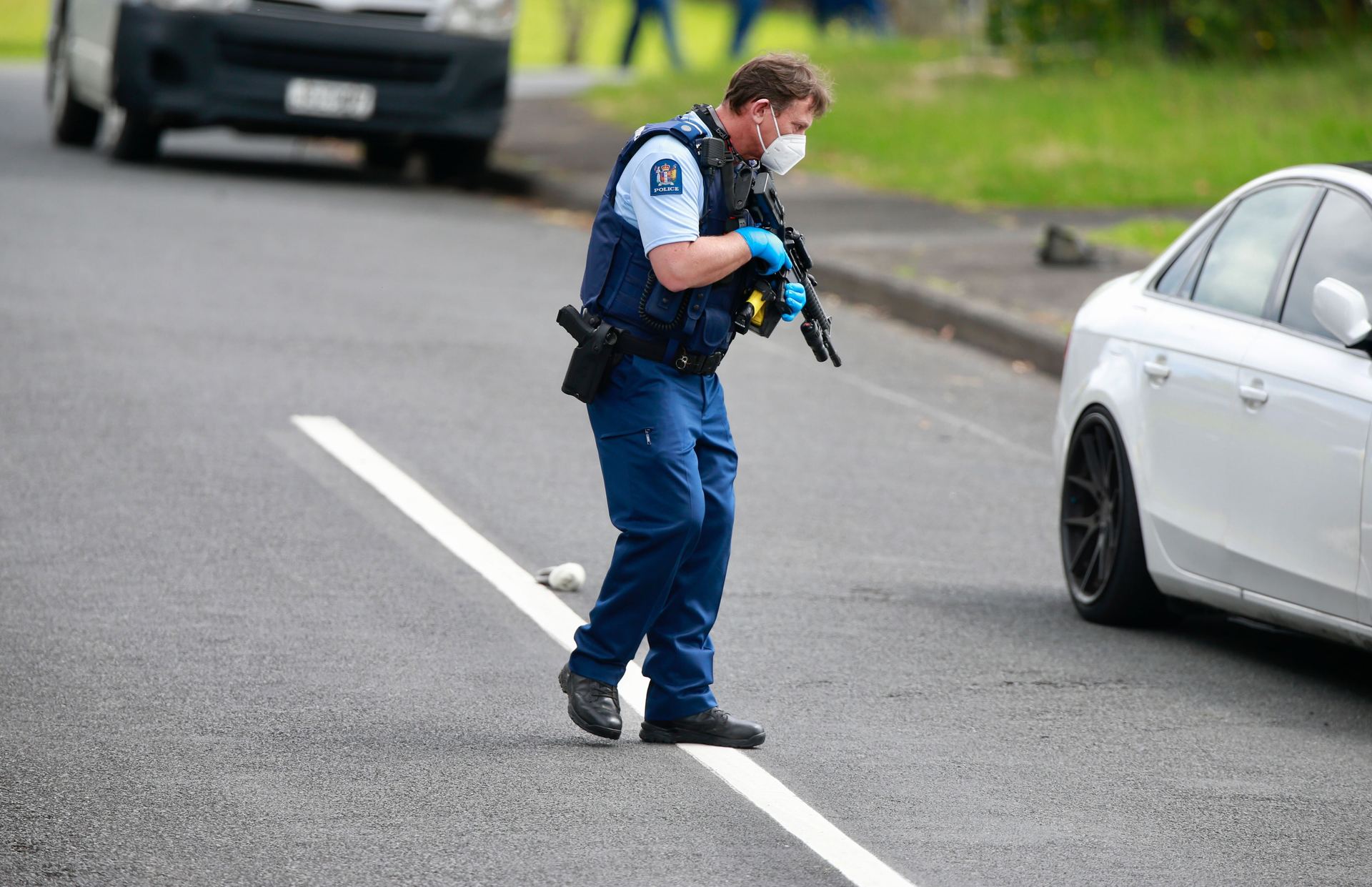 Police officers at the scene in Glen Eden. Photo / Alex Burton