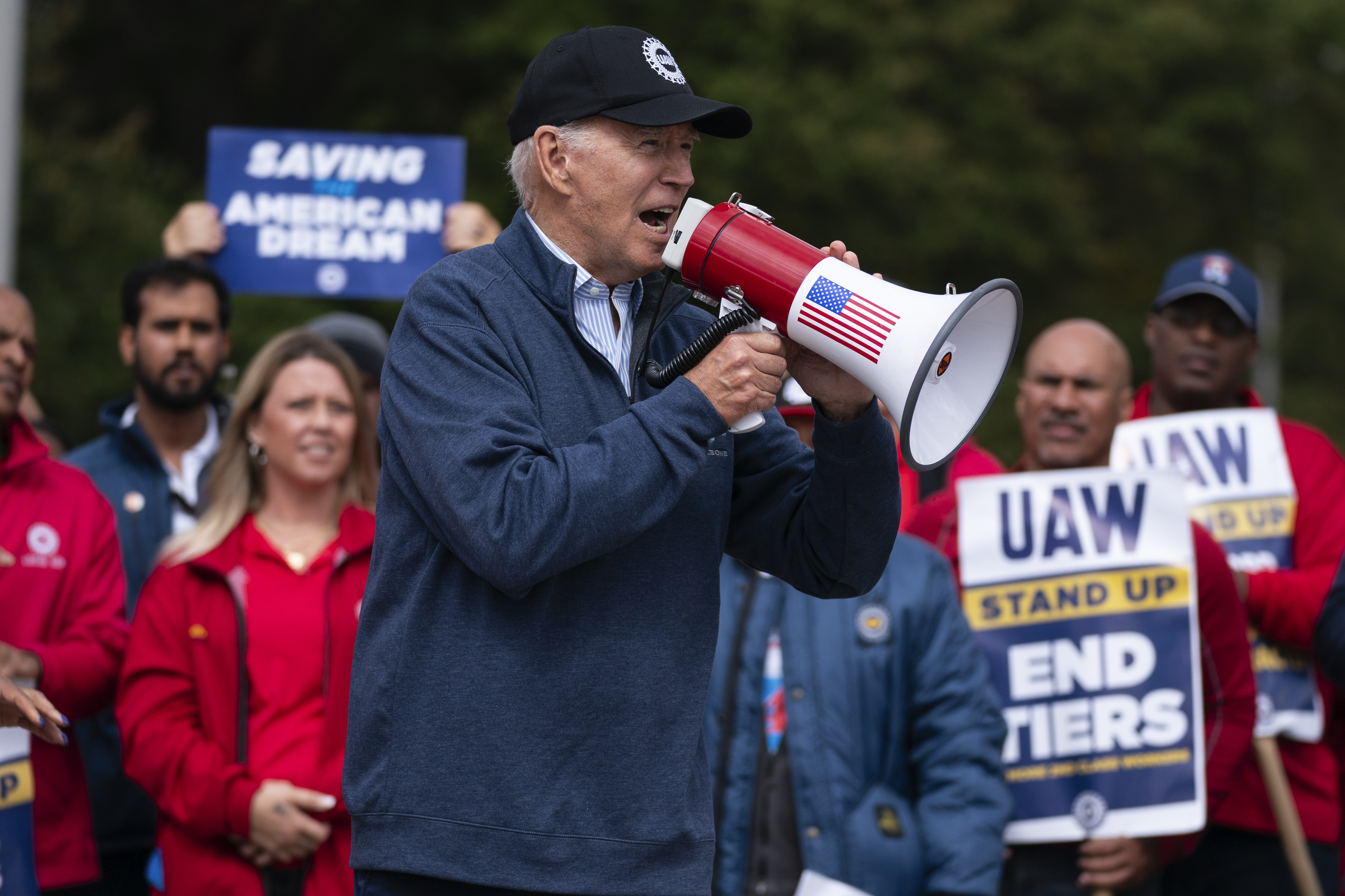 President Joe Biden speaks to striking United Auto Workers on the picket line outside the Willow Run Redistribution Centre. Photo / AP