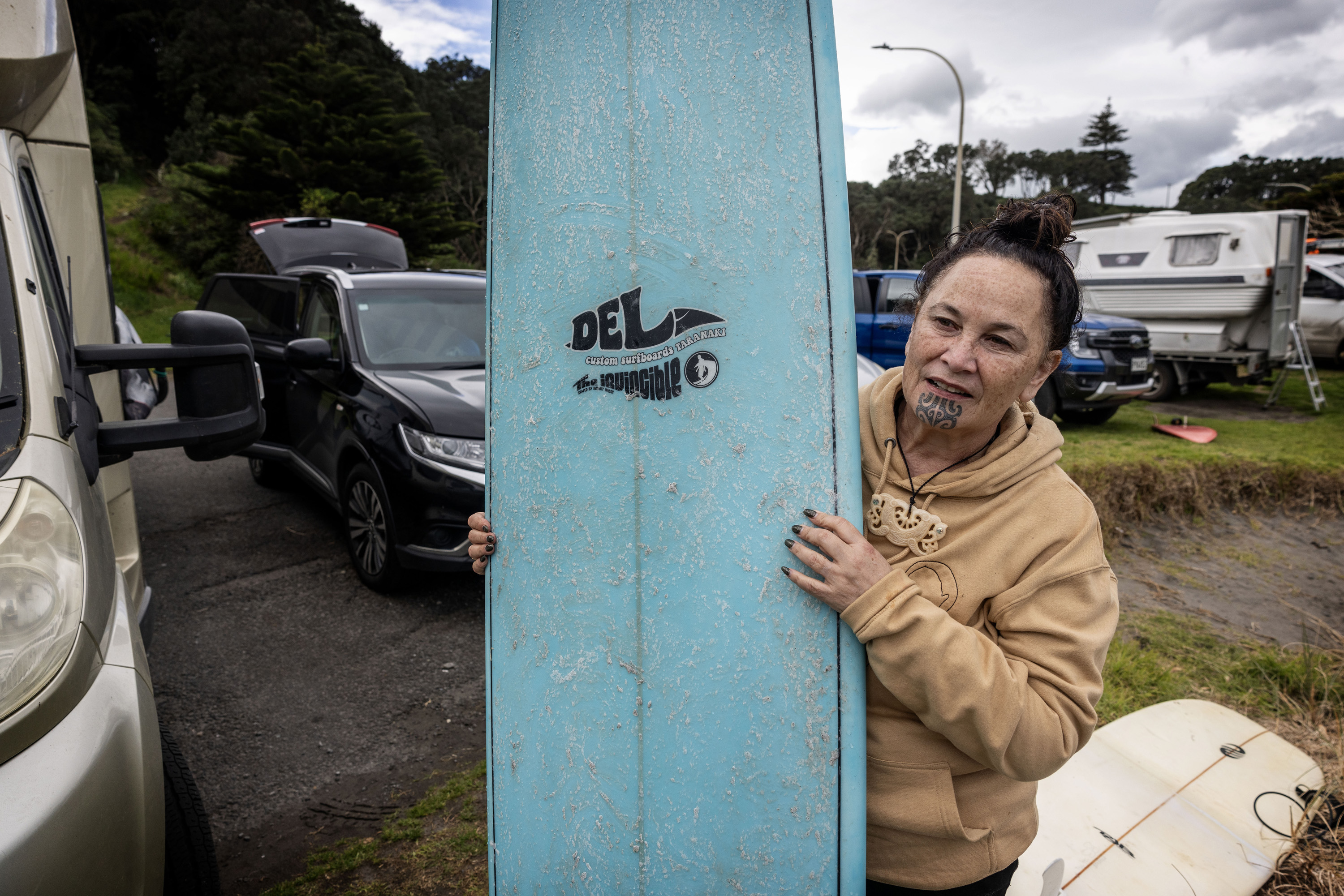 Te Pāti Maori co-leader Debbie Ngarewa Packer, a keen surfer after growing up in Pātea in South Taranaki, goes for a surf at Ōpunakē. Photo / Mike Scott