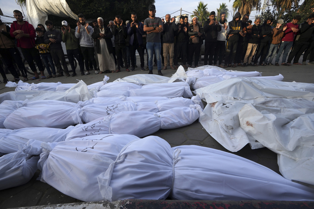 Palestinians gather at the morgue at Deir al-Balah's hospital to mourn relatives killed in the Israeli bombardment of the Gaza Strip. More than 17,400 people have been killed in Gaza since October, according to the territory’s Health Ministry. Photo / AP