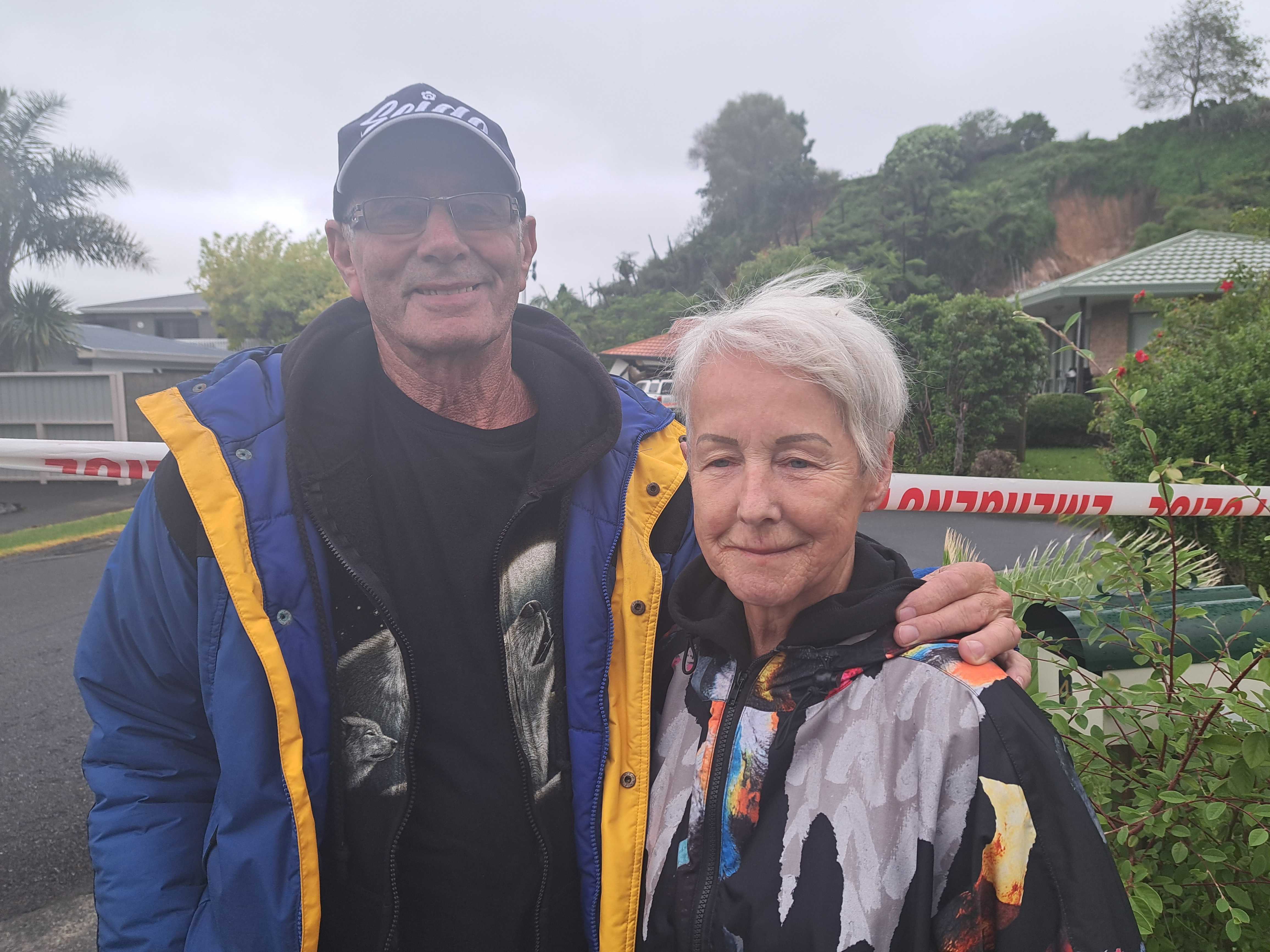 Dave and Sue Harding outside the landslide on Egret Ave, Tauranga, that destroyed homes. Photo / Carmen Hall