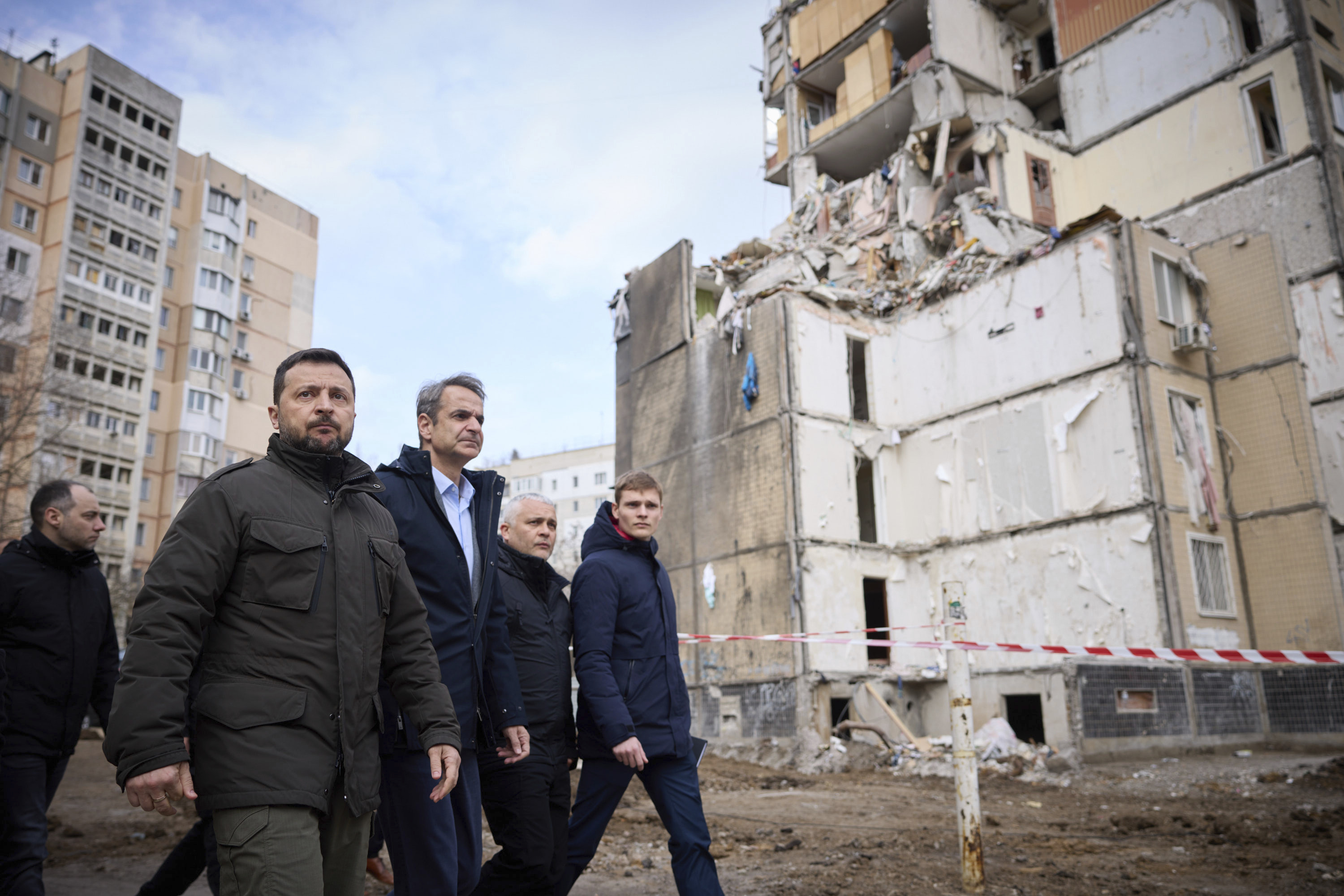 Ukrainian President Volodymyr Zelenskyy, second from left, and Greece's Prime Minister Kyriakos Mitsotakis, third from left, walk in a residential area damaged by Russian attack in Odesa, Ukraine. Photo / AP