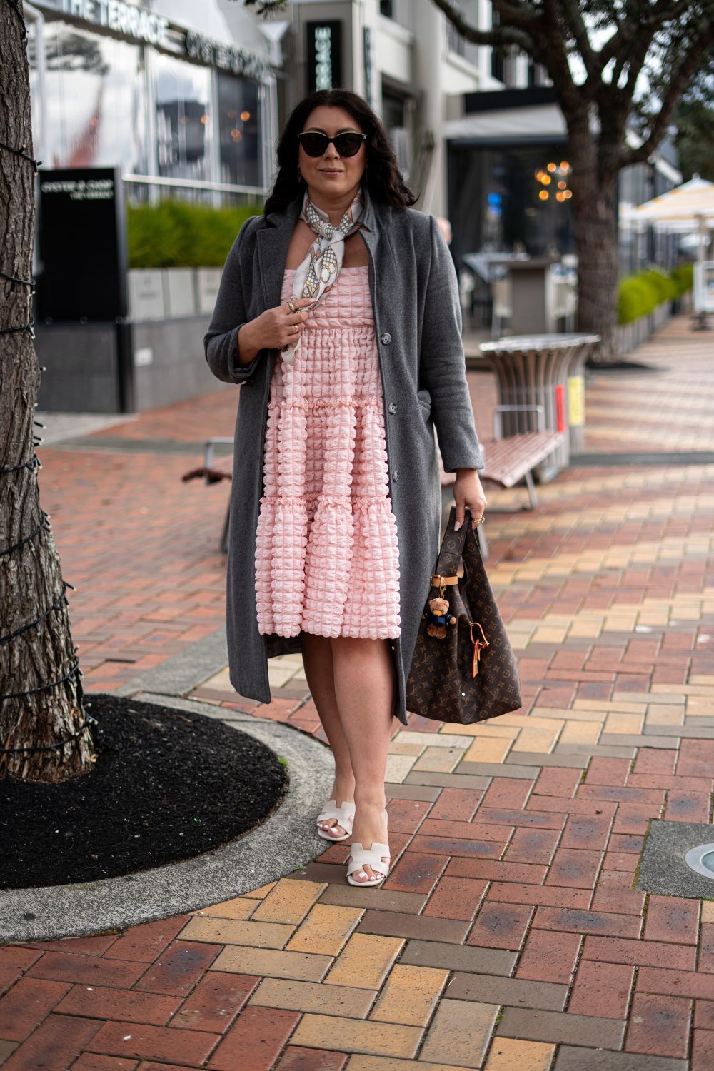 In line for the Auckland AFC kit launch at Soul Bar and Bistro, Natalia Abbott wears Trelise Cooper dress, Buffer jacket, Hermes shoes, Louis Vuitton bag and Ritz teddy bear keyring. Photo / Alyse Wright