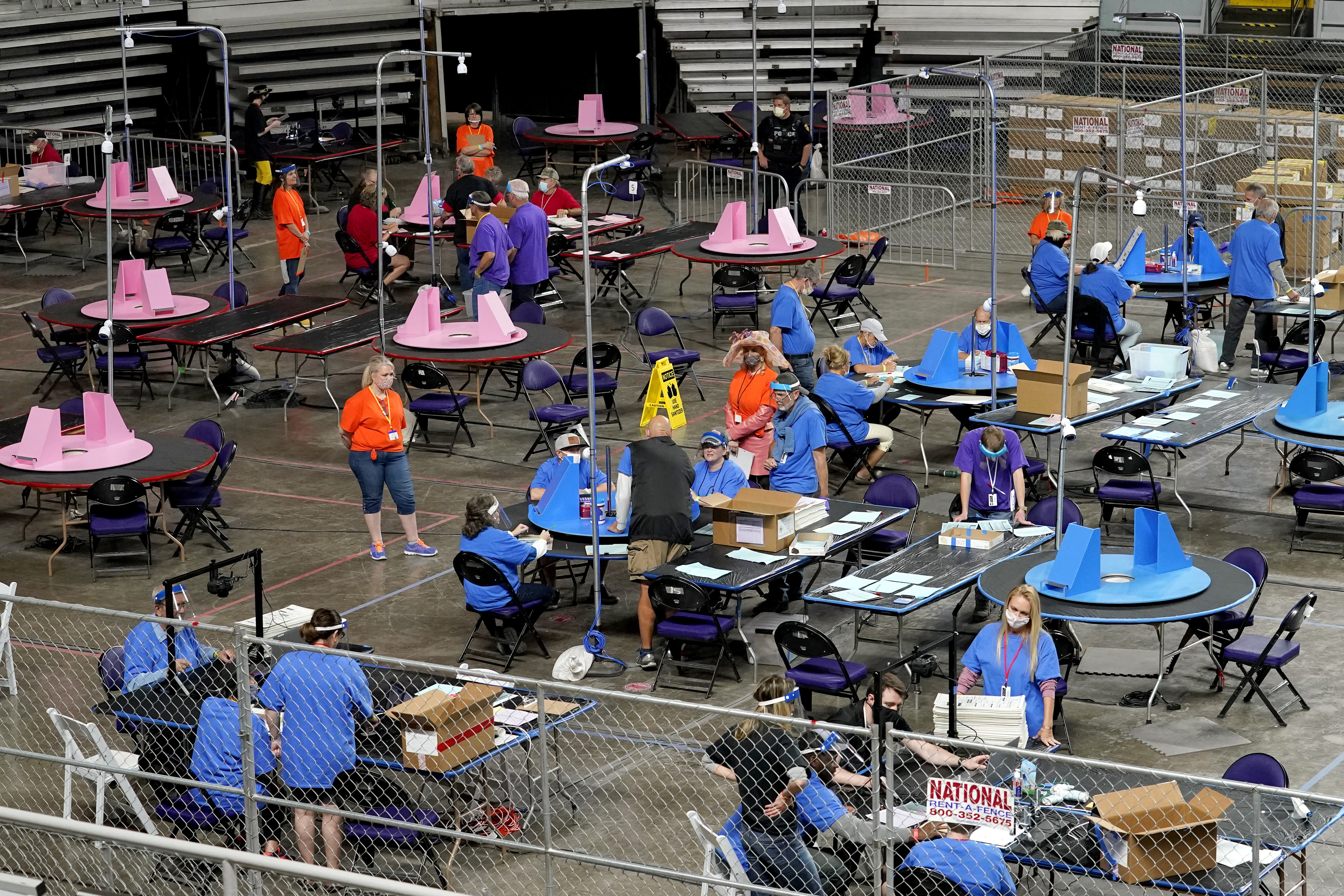 Maricopa County ballots cast in the 2020 general election are examined and recounted by contractors working for Florida-based company Cyber Ninjas at Veterans Memorial Coliseum in Phoenix. Photo / AP