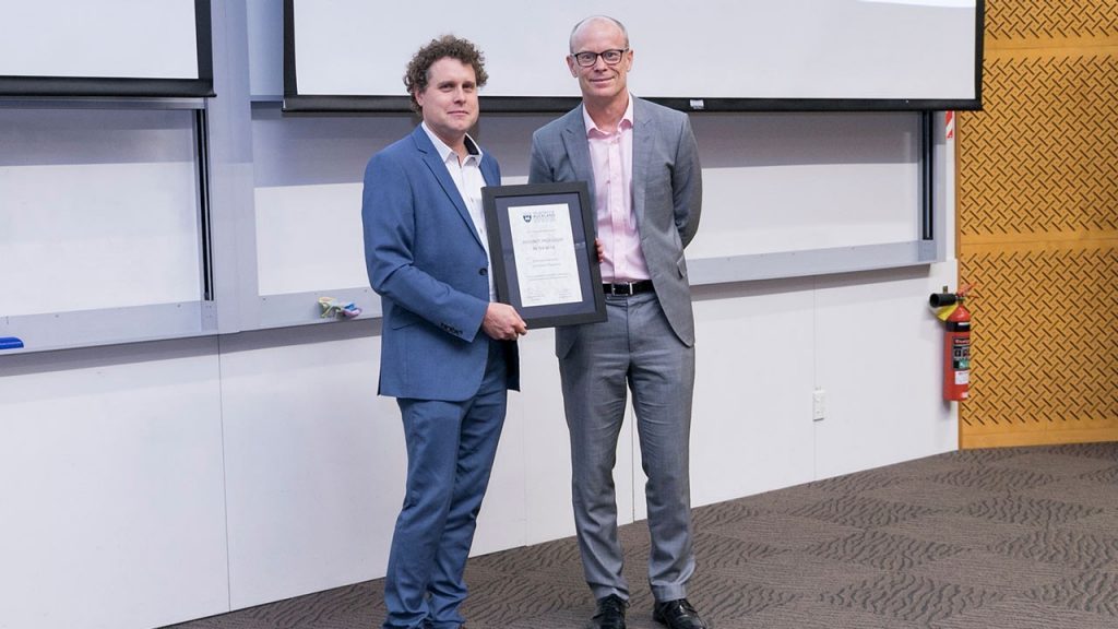 Rocket Lab founder Peter Beck - who left school at 17 for an apprenticeship at F&P - receives his Auckland University Engineering School Adjunct Professorship from Prof Nic Smith in Nov 2019.