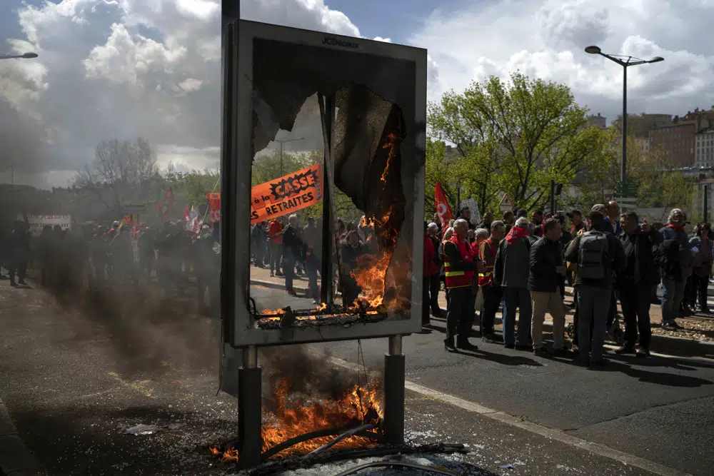 Protesters match during a demonstration in Lyon, central France. Photo / AP