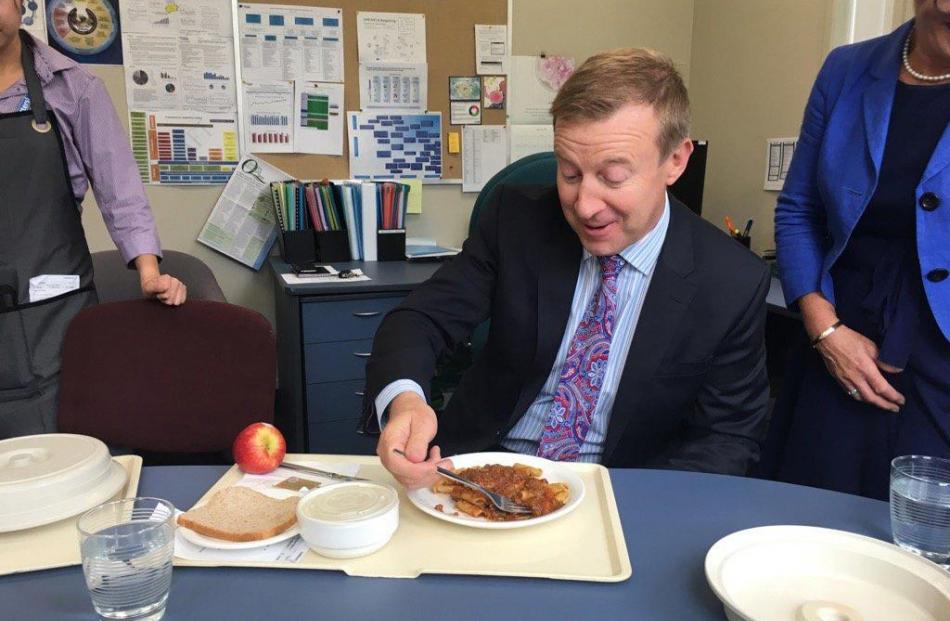 Jonathan Coleman sampled some of Compass Group's food at hastily arranged luncheon back in April, after numerous complaints about the quality of food. Photo / Twitter