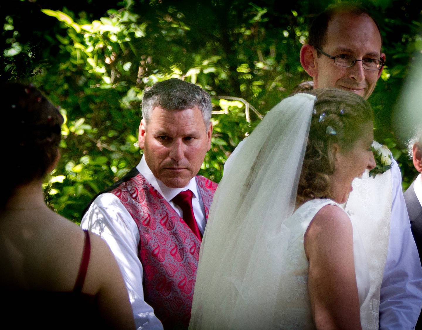 Groomsman Paul Wilson (left), with newly married couple David Bain (right), and Liz Davies (centre), after their wedding ceremony in Christchurch. Photo / Supplied 