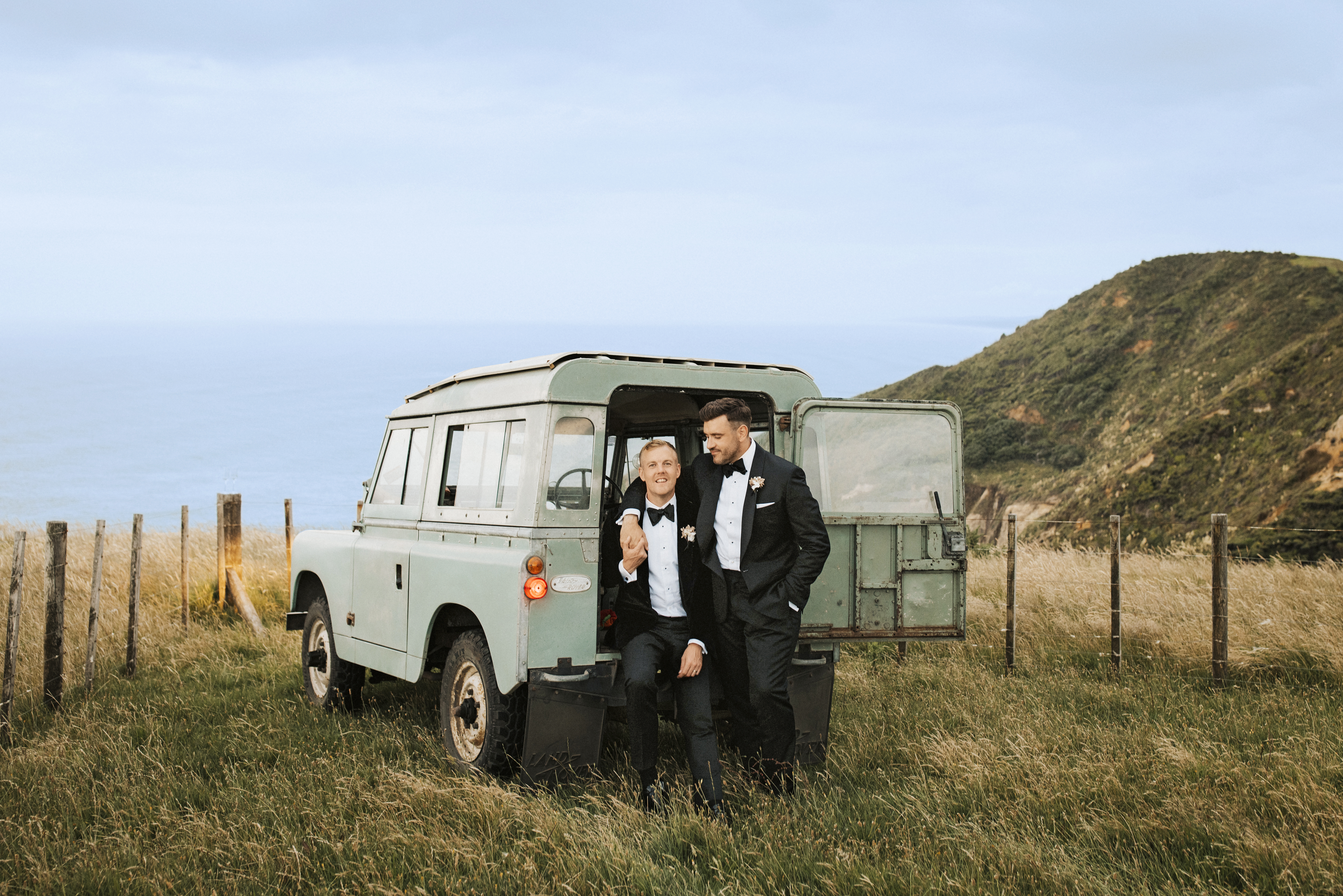 McLean and Teece pose for photos with Vaughan Smith's vintage Land Rover. Photo / Sophie Isabella Photography