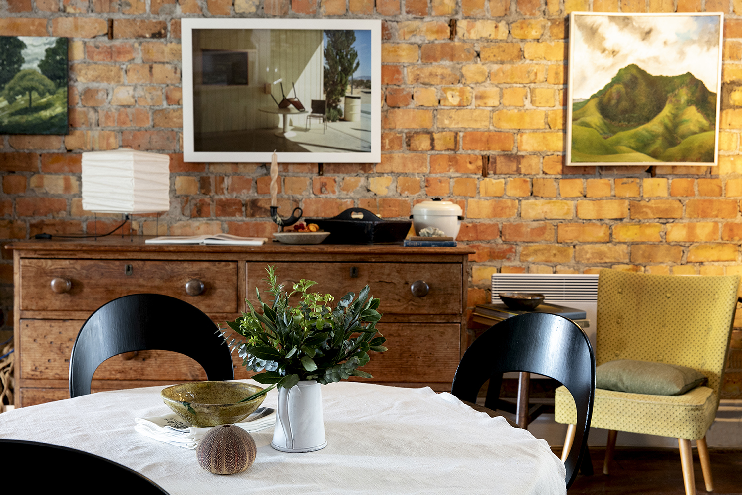 Look for Light, 2020, by Henrietta Harris hangs above the table. Photo / Babiche Martens