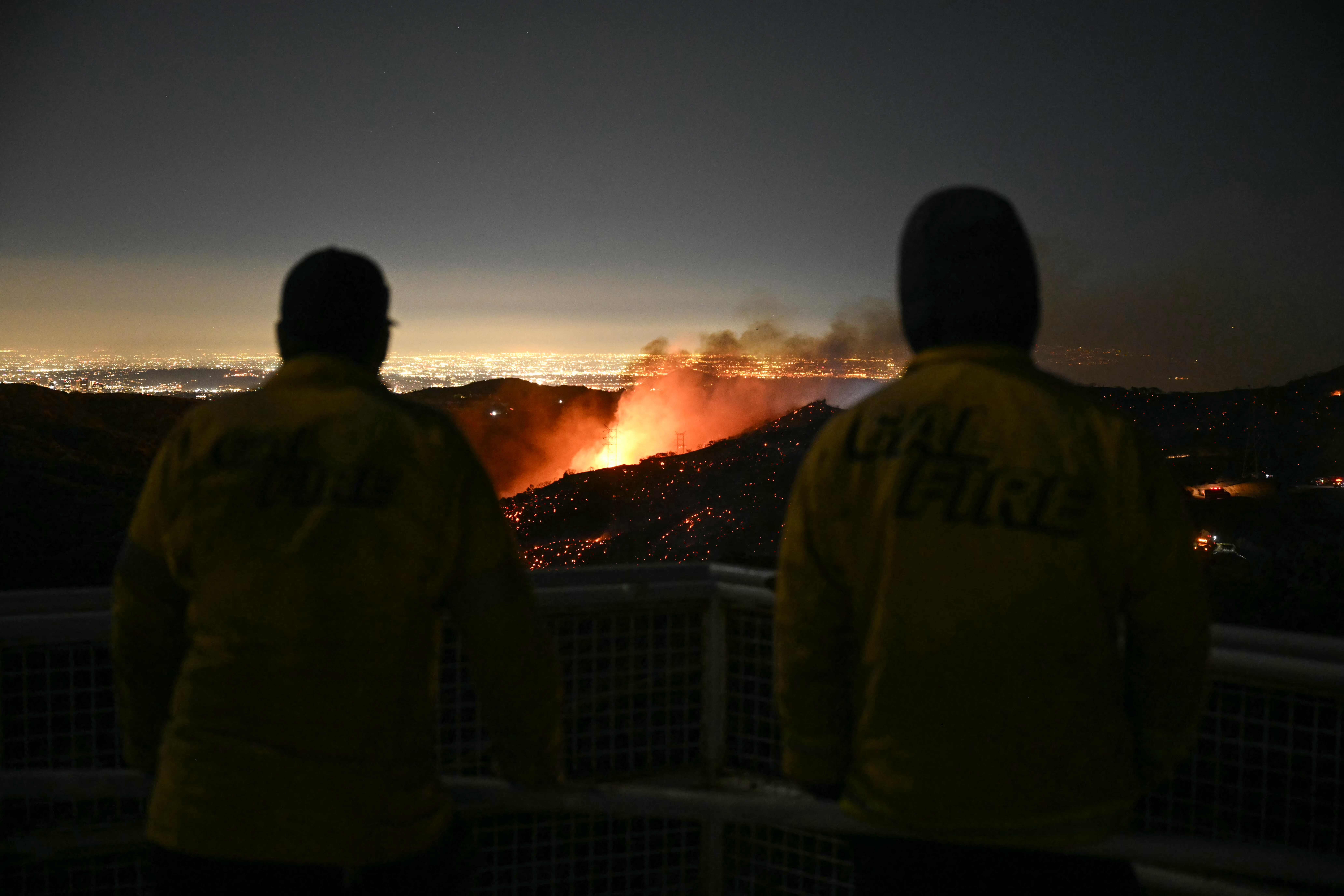 Firefighters were seen monitoring the Palisades fire over the weekend, as it spread near the Mandeville Canyon neighbourhood and Encino. Photo / AFP