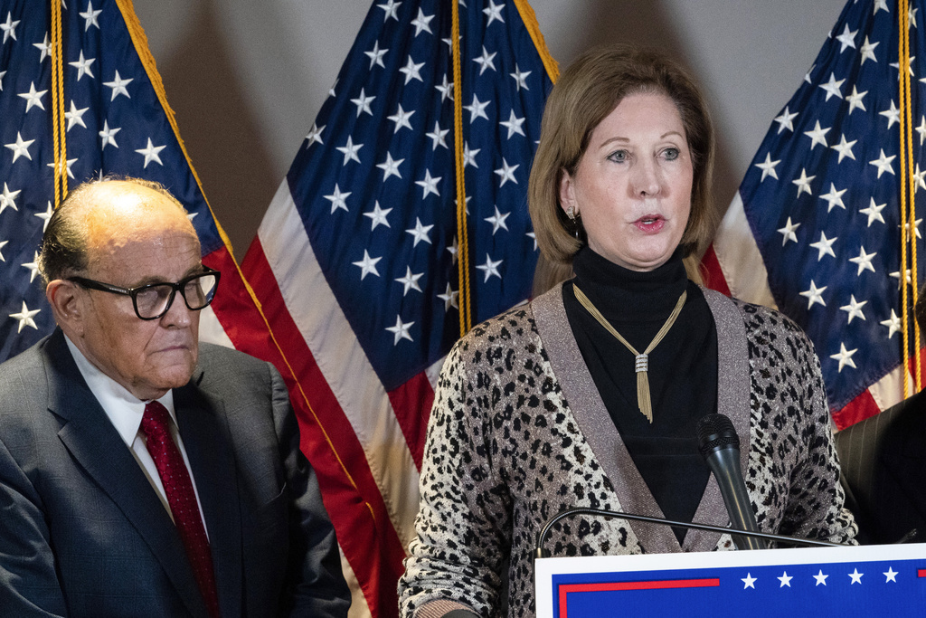 Sidney Powell speaks next to former Mayor of New York Rudy Giuliani, as members of US President Donald Trump's legal team, on November 19, 2020, in Washington. Photo / AP