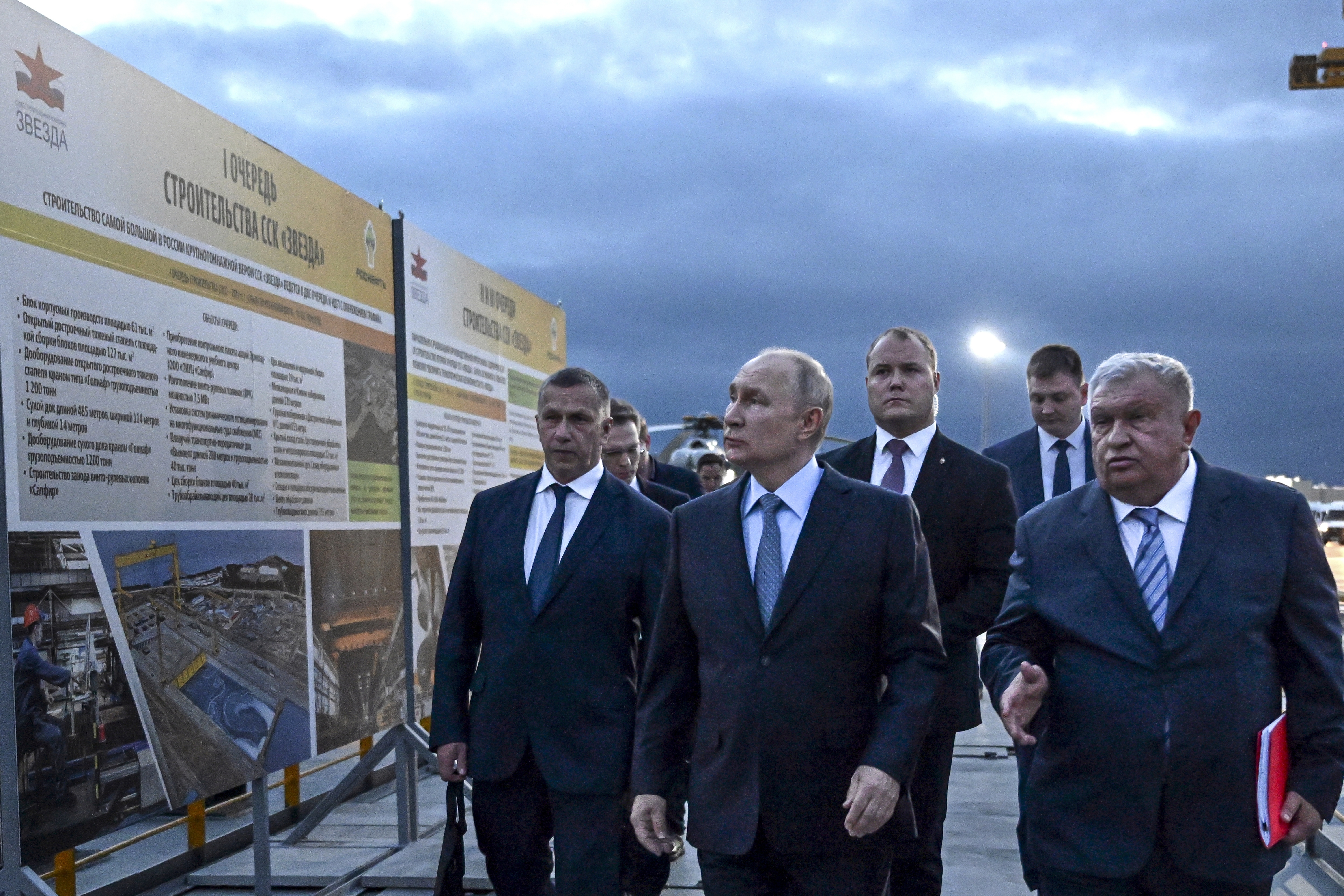 Russian President Vladimir Putin, center, and Russian CEO of Rosneft oil company Igor Sechin, right. Photo / AP