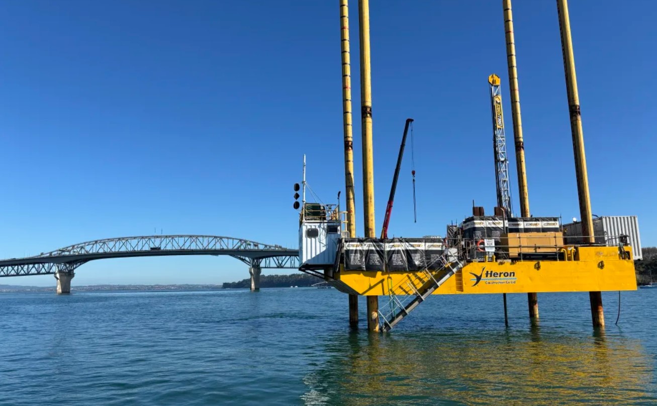 The yellow platform in Waitematā Harbour gathers seabed data for a new crossing. Photo / Davina Zimmer / RNZ