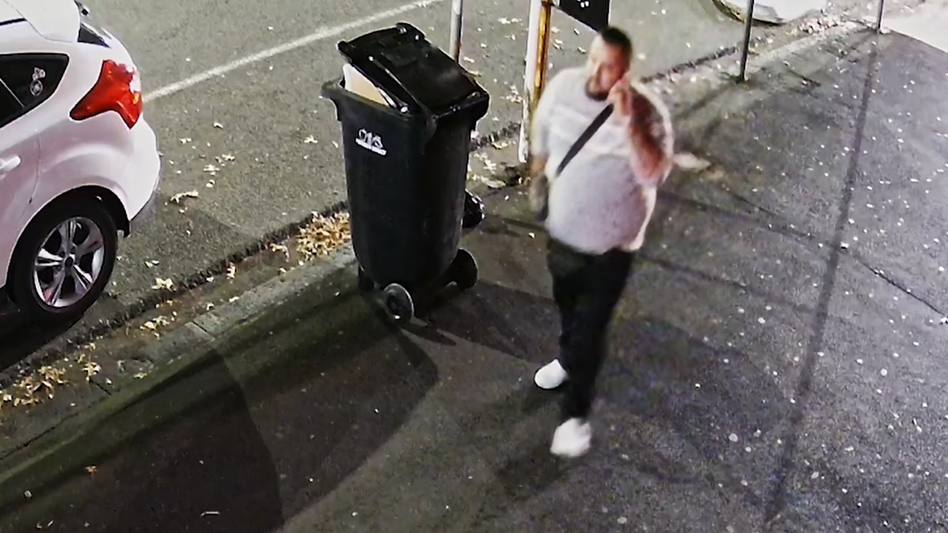 The man wanted by police in relation to the Ponsonby Rd shooting can be seen talking on his cellphone in the moments after the shooting.