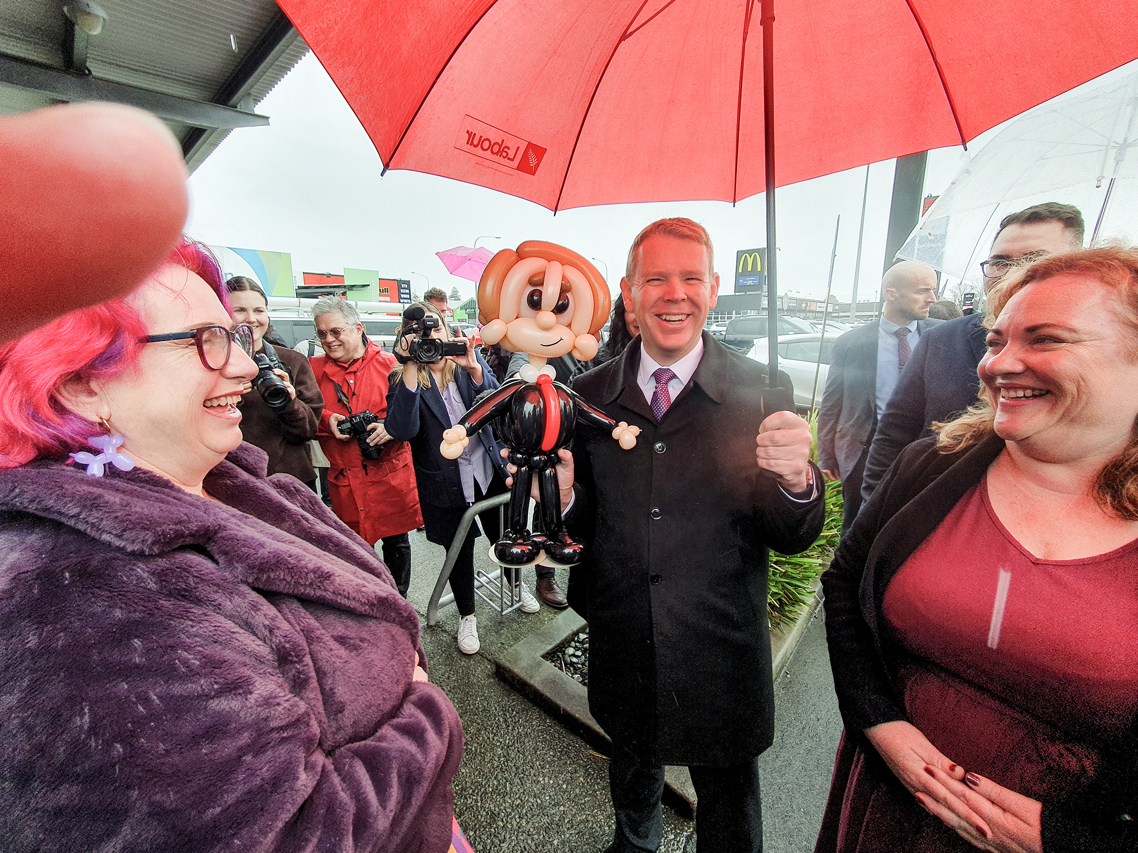 Labour leader Chris Hipkins with a collection of balloons to his likeness while campaigning in Nelson today. Photo / Tim Cuff