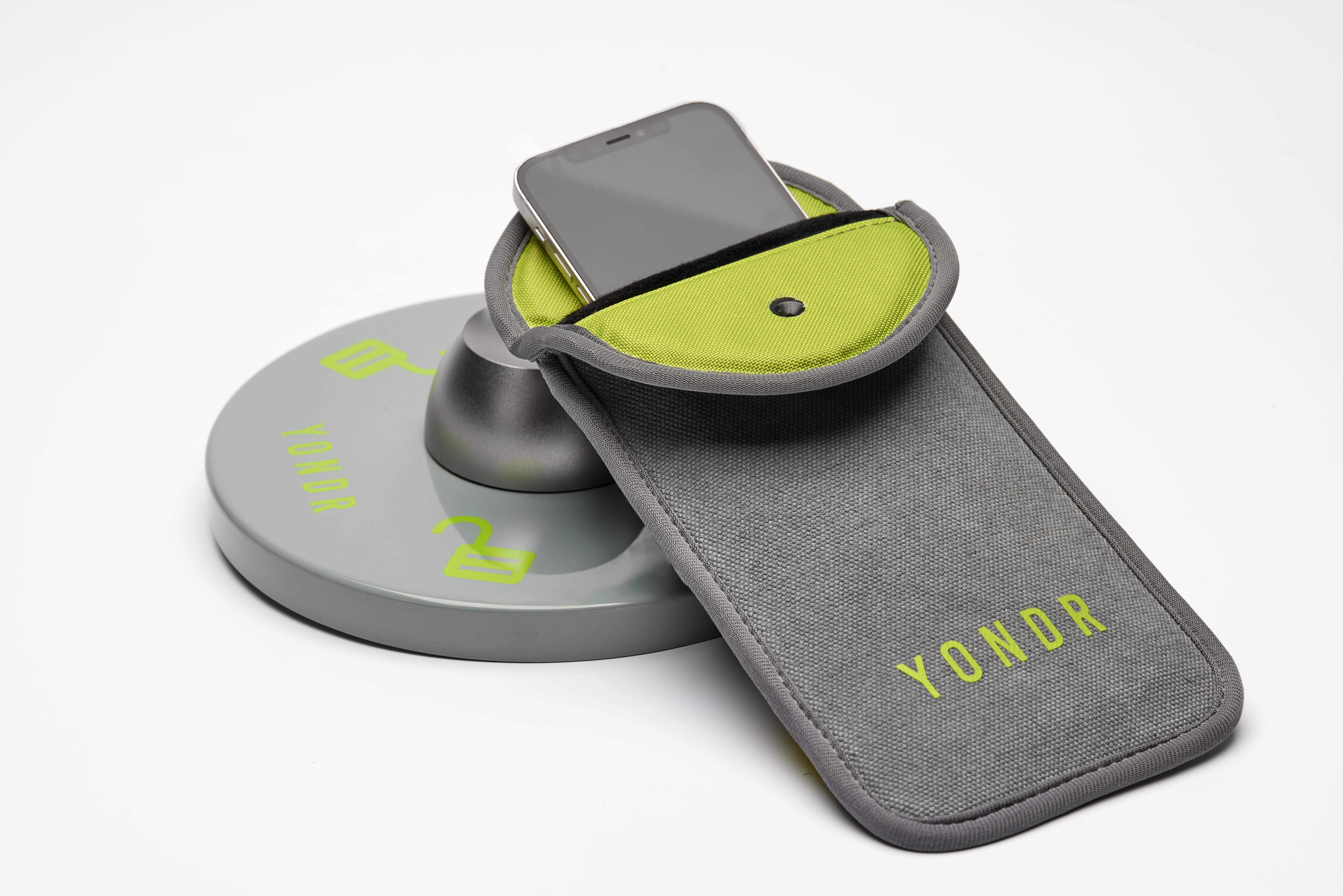 A Yondr pouch ($22) and unlocking base ($120). Photo / Supplied