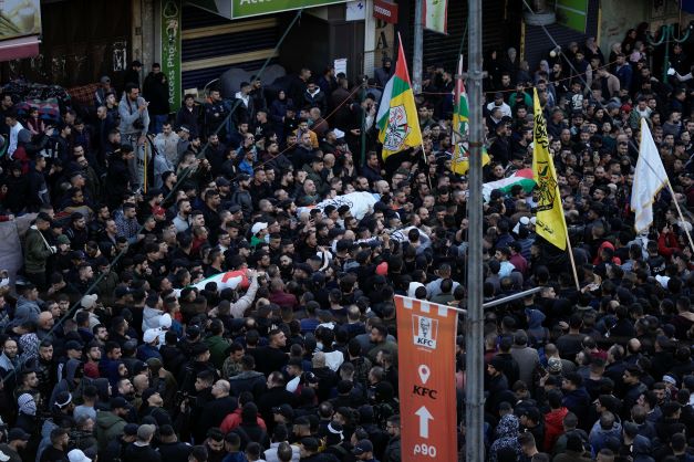 Palestinians carry the bodies of men killed in clashes with Israel troops in the West Bank city of Nablus on Wednesday. Photo / AP