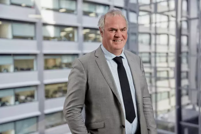 Commerce Commission chair John Small is leading the agency's fight with Foodstuffs as it pursues an uphill battle to merge.