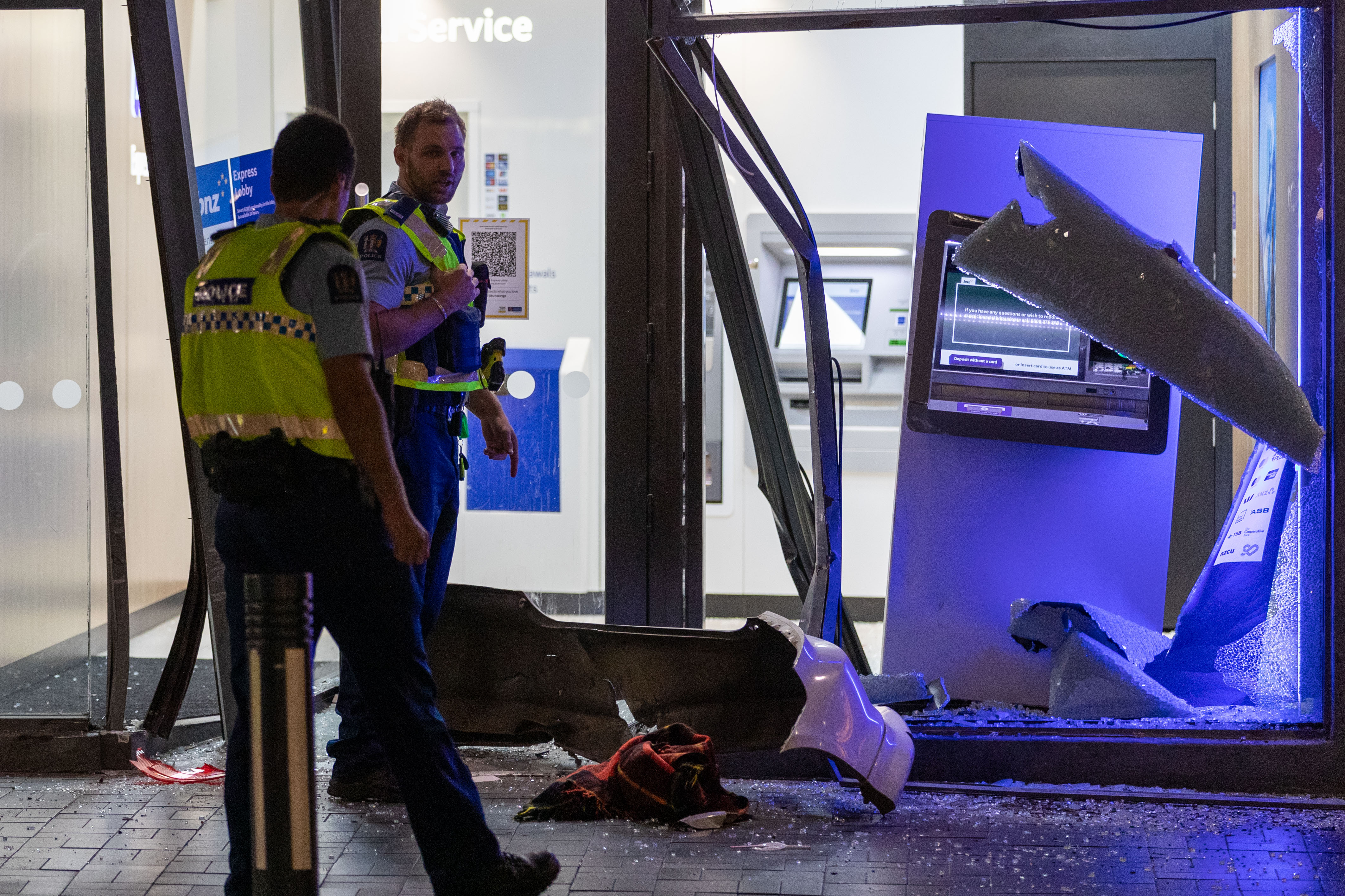 Police at the scene of the ram-raid on BNZ Bank in Queenstown. Photo / James Allan