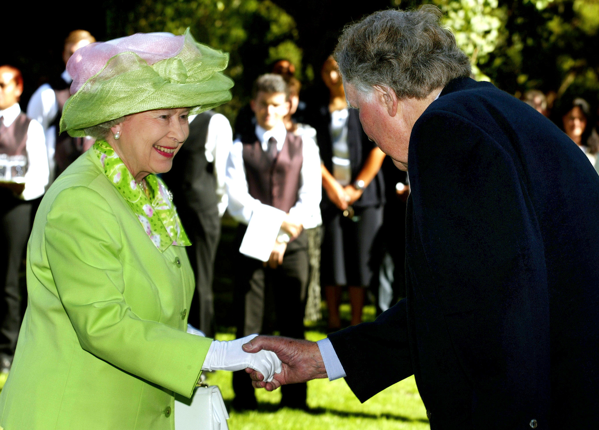 Queen Elizabeth II chatting with Sir Edmund Hillary at a garden reception in February, 2002. Photo / Brett Phibbs, File