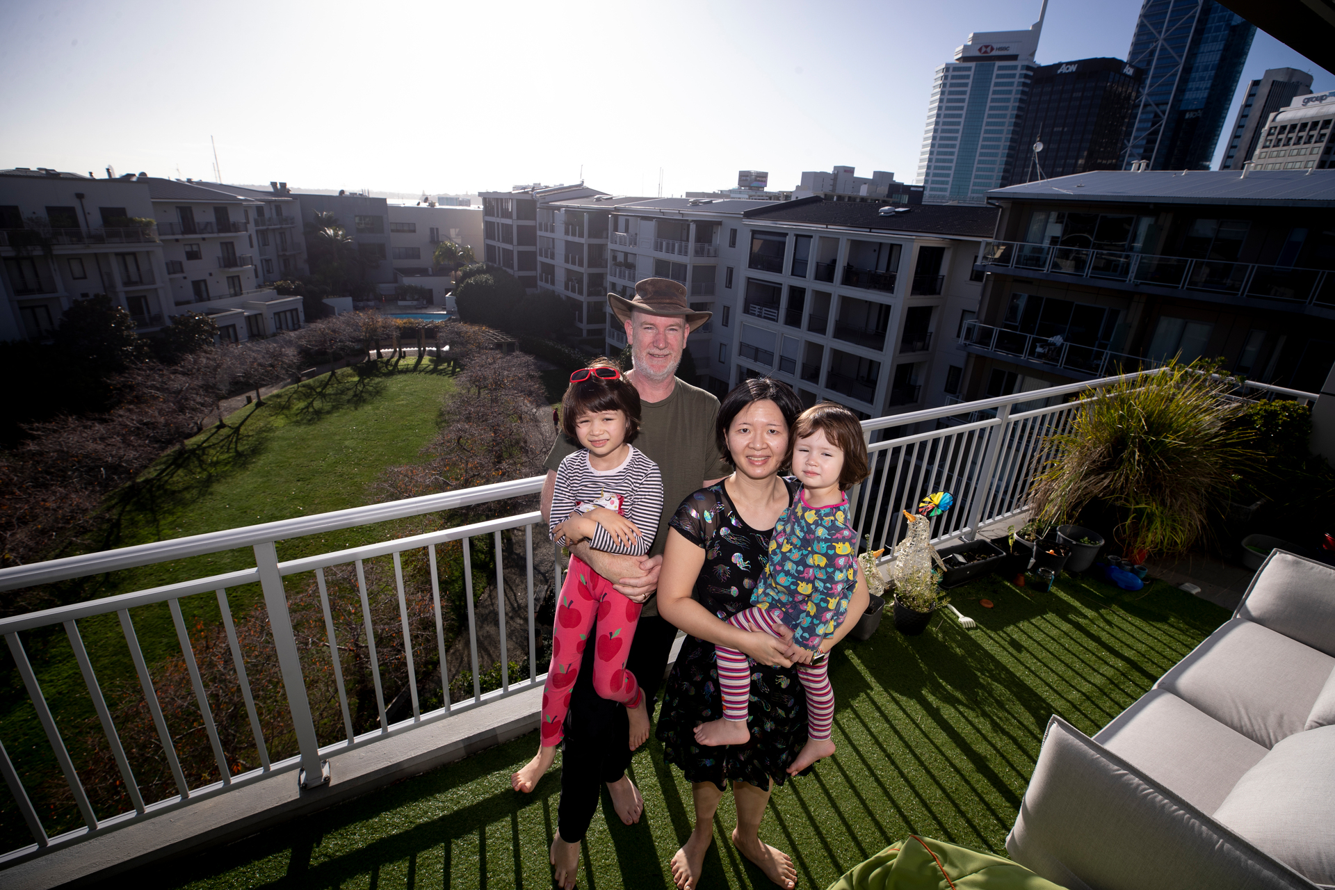 Lance Wiggs and Su Yin Khoo, with their kids Ada Wiggs, 6, and Edna Wiggs, 2, live in the Parc apartment complex at Auckland's Viaduct. Photo / Dean Purcell 