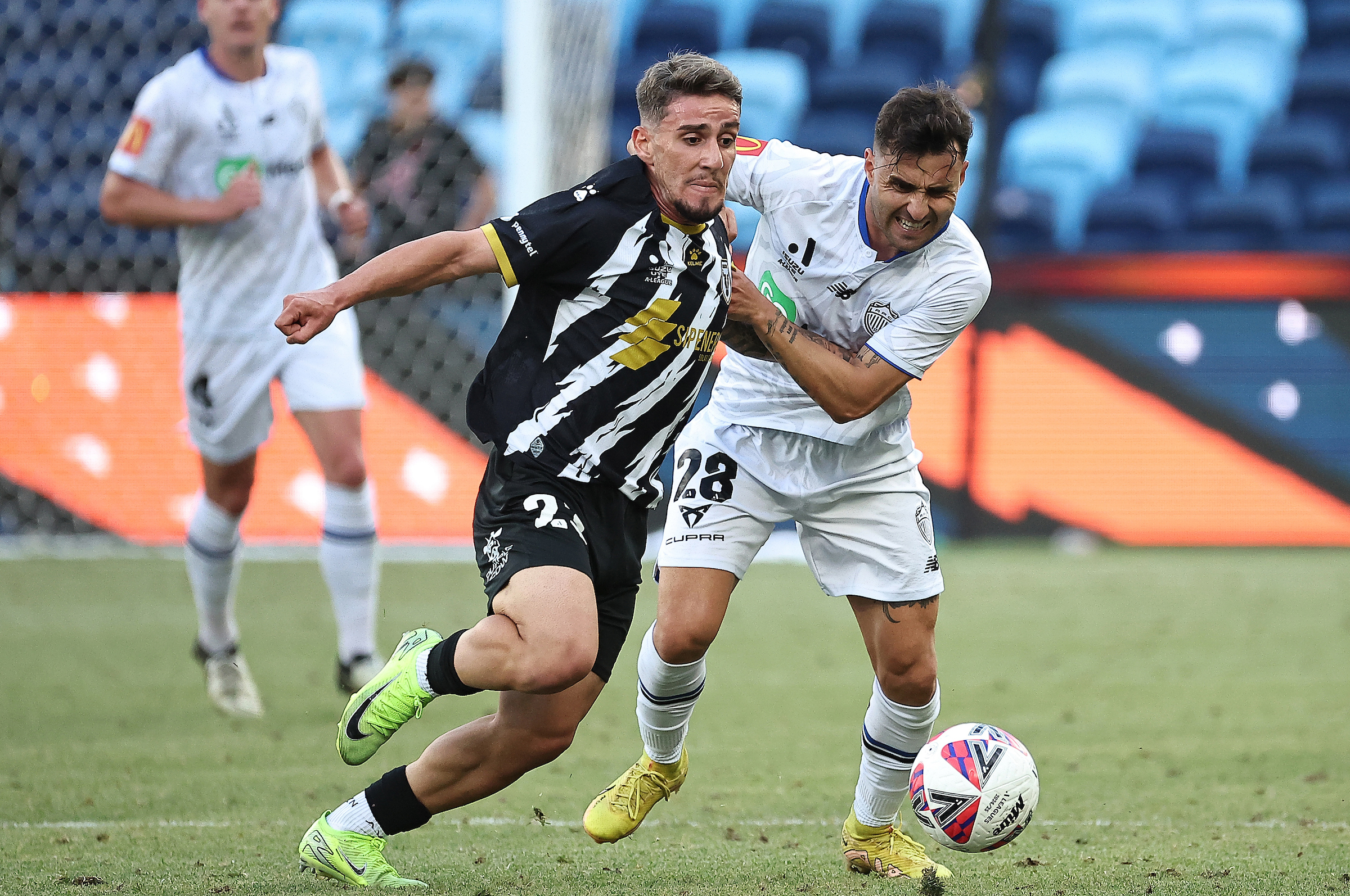 Felipe Gallegos of Auckland FC and Frans Deli of the Bulls challenge for the ball. Photo / Photosport