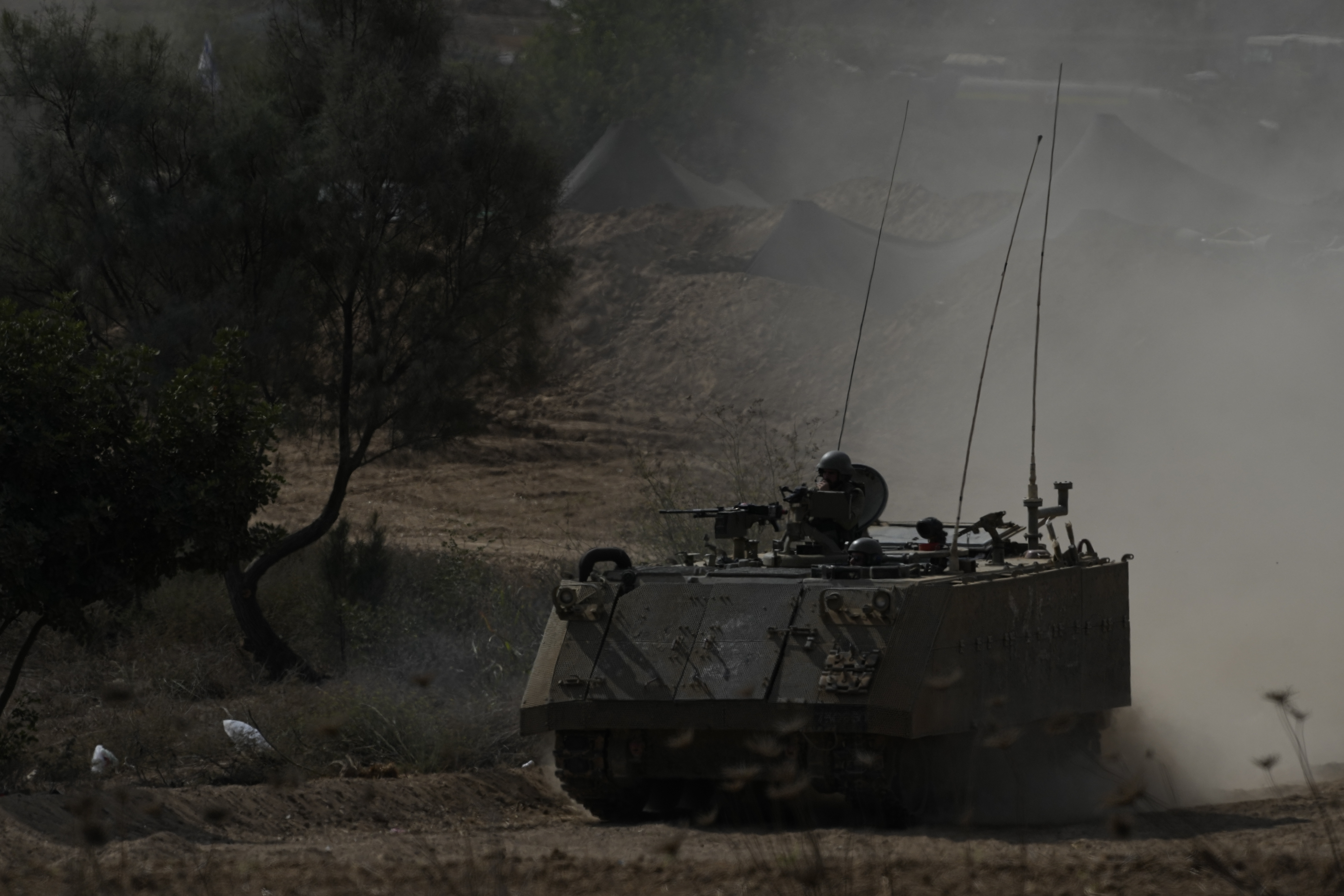 An Israeli armoured personnel carrier moves near the border with Gaza. Photo / AP