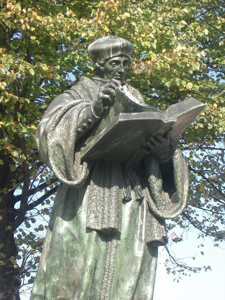 A statue of Erasmus in Rotterdam shows him with a large book and wearing a large hat. Photo / File