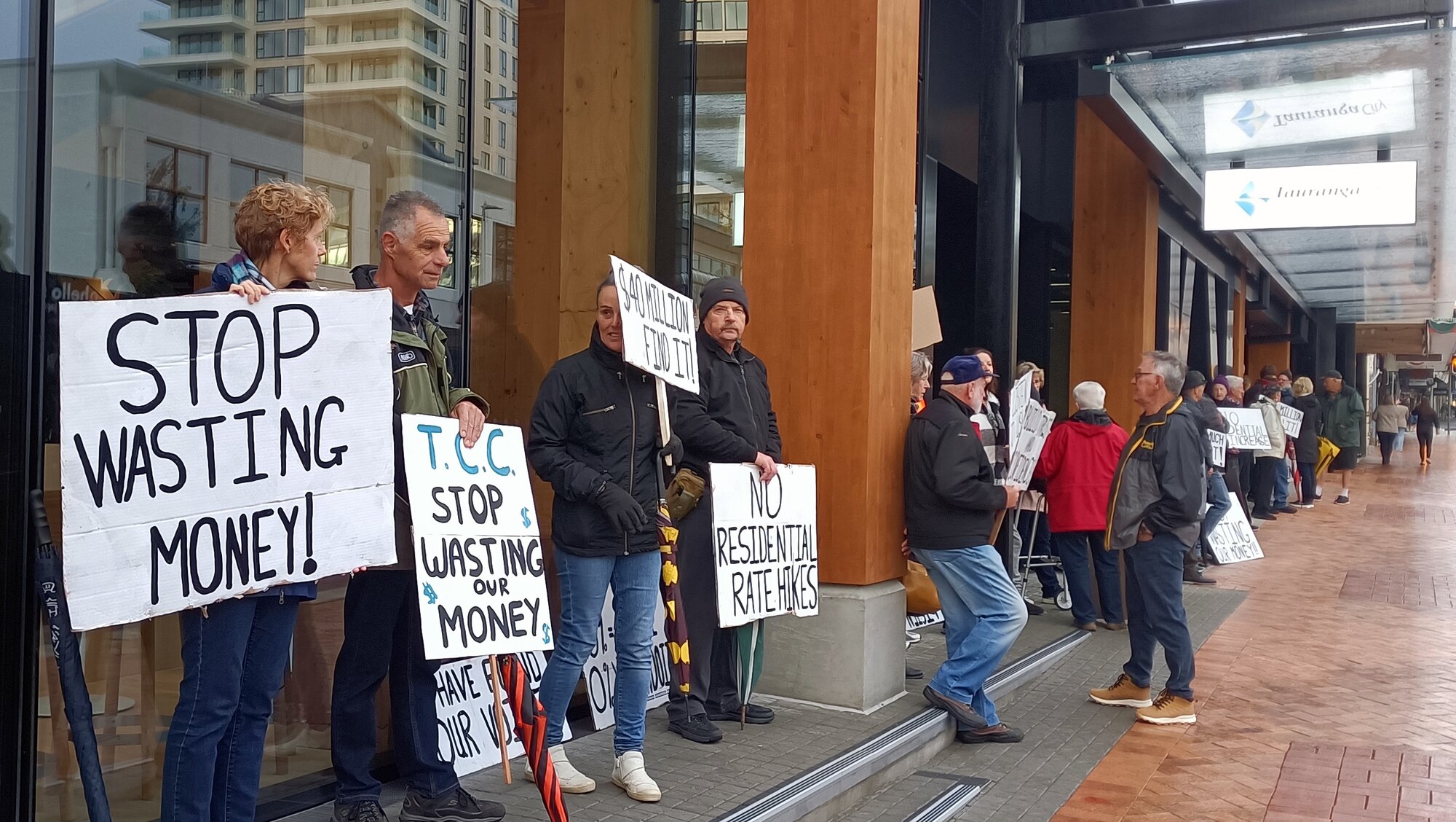 Some of the 60 people who gathered outside the Tauranga City Council building to protest the 9.9% rates increase on Thursday morning. Photo / Supplied